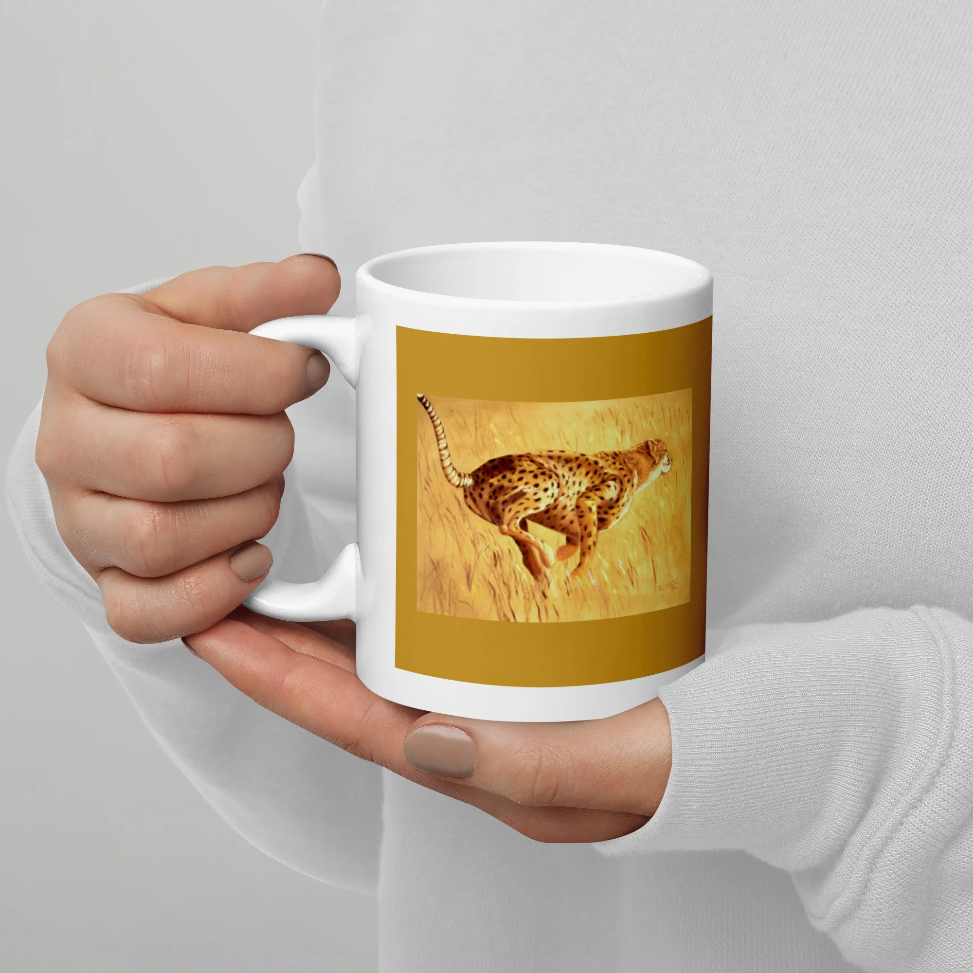 11 oz ceramic mug with Need for Speed oil wrap by Beverly G. McCarter, cheetah sprint on golden-savanna background.
