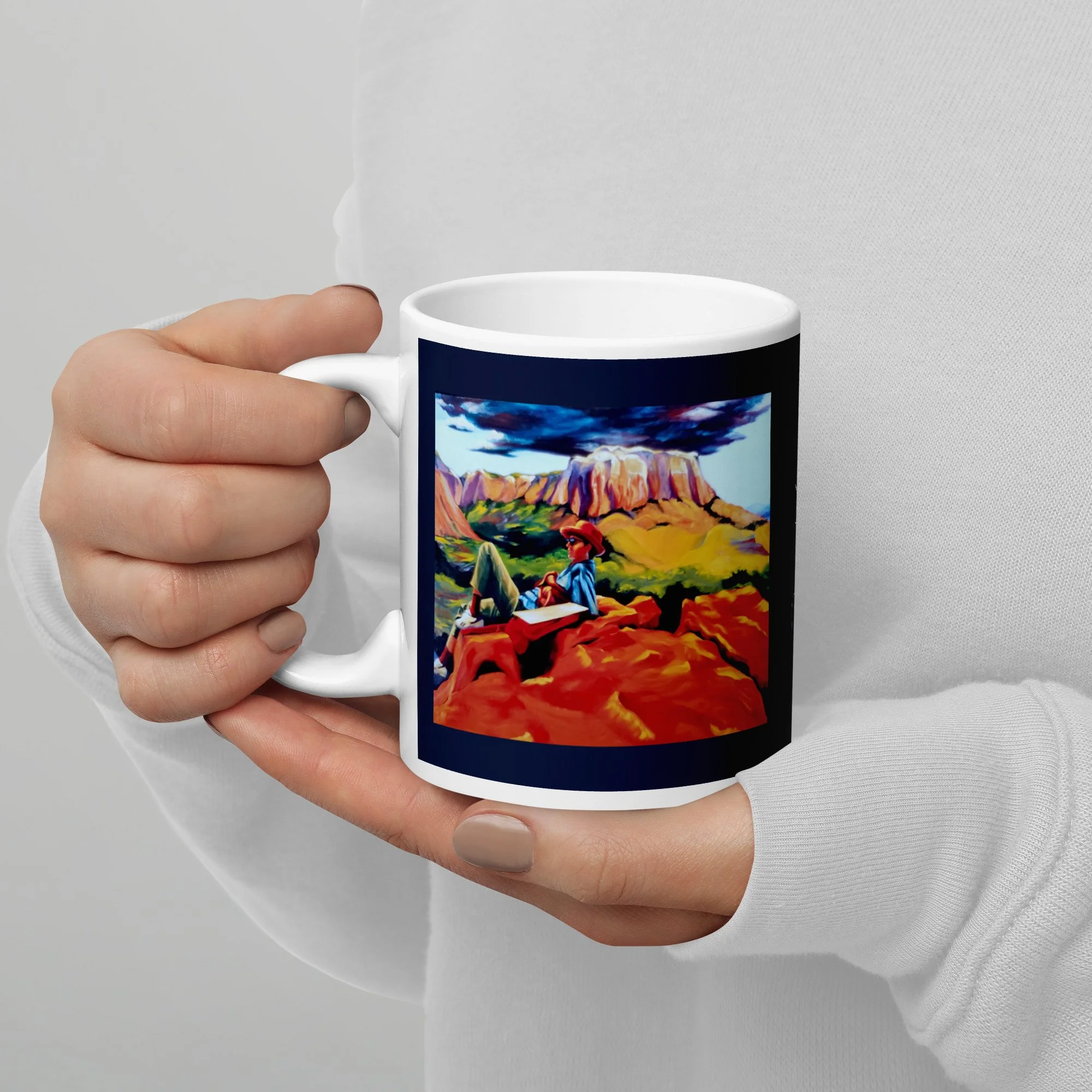 11 oz ceramic mug with On the Edge oil wrap by Beverly G. McCarter, red rocks and storm sky on gray background.