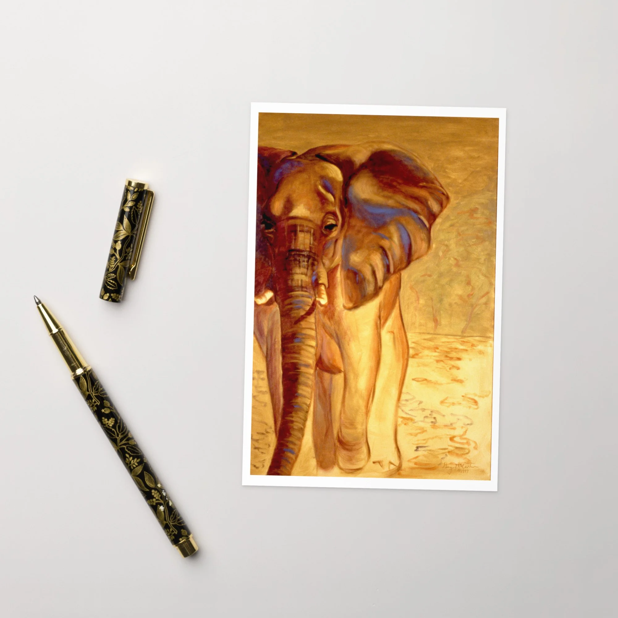 “Almost Gone” 1997 oil by Beverly G. McCarter – solitary elephant emerging from golden savanna light with soulful gaze and textured trunk, set of 5 Fine Art Note Cards.