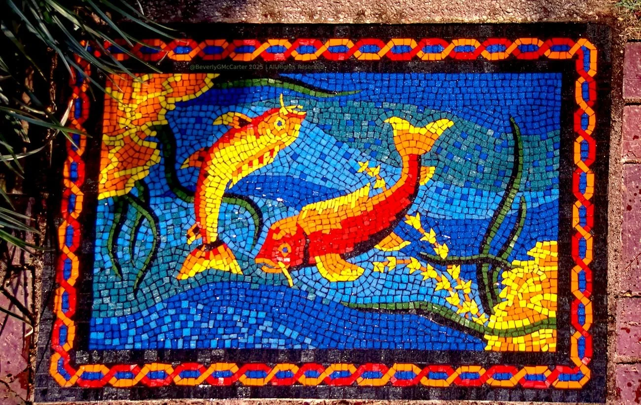 Garden Koi mosaic by Beverly G. McCarter, vitreous glass tile koi fish in garden pathway at gated entrance, 2000, 2x3 feet.