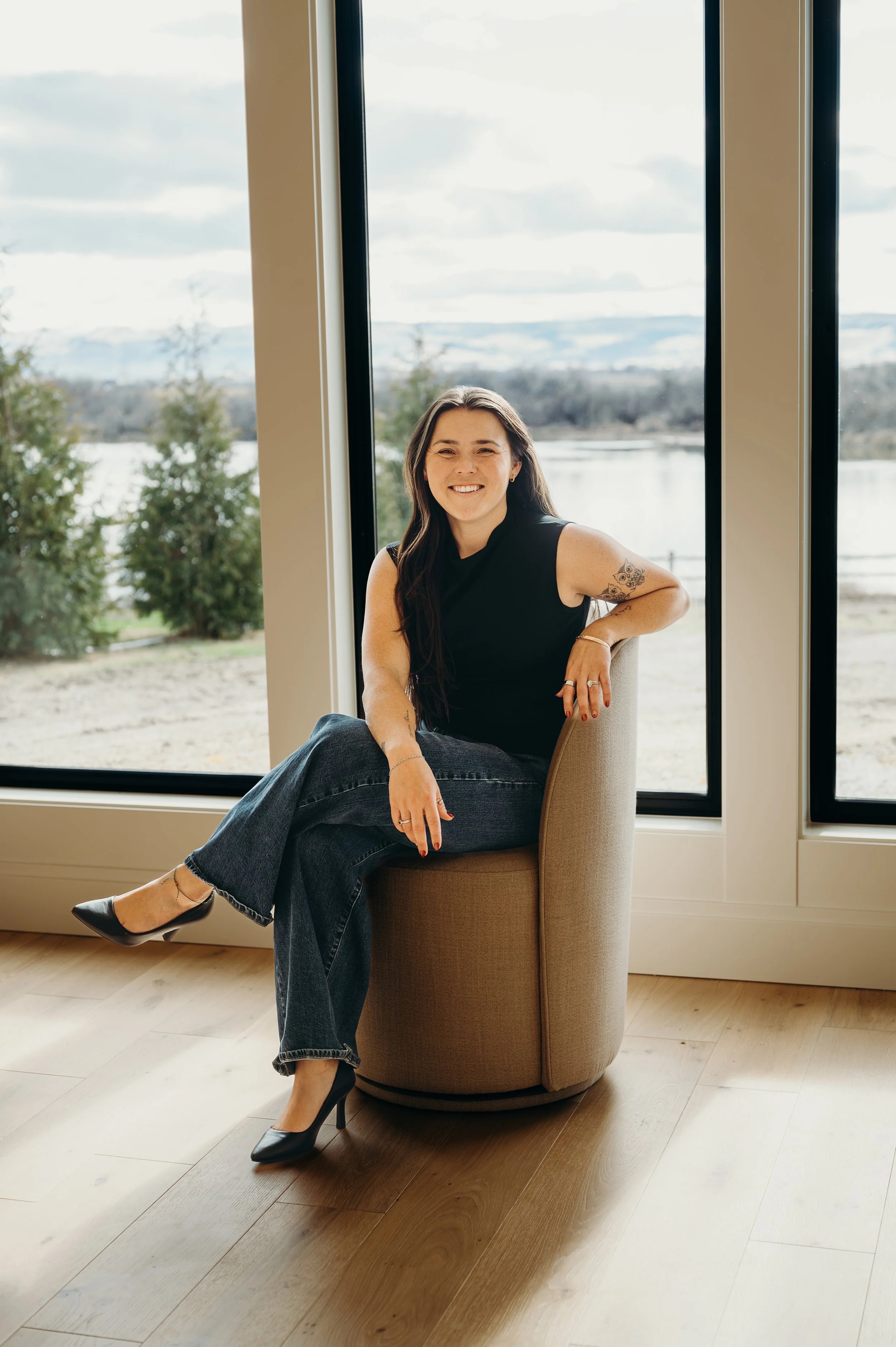 Treasure Valley Idaho Real Estate Agent, Dani Gonzales, smiling in the office.