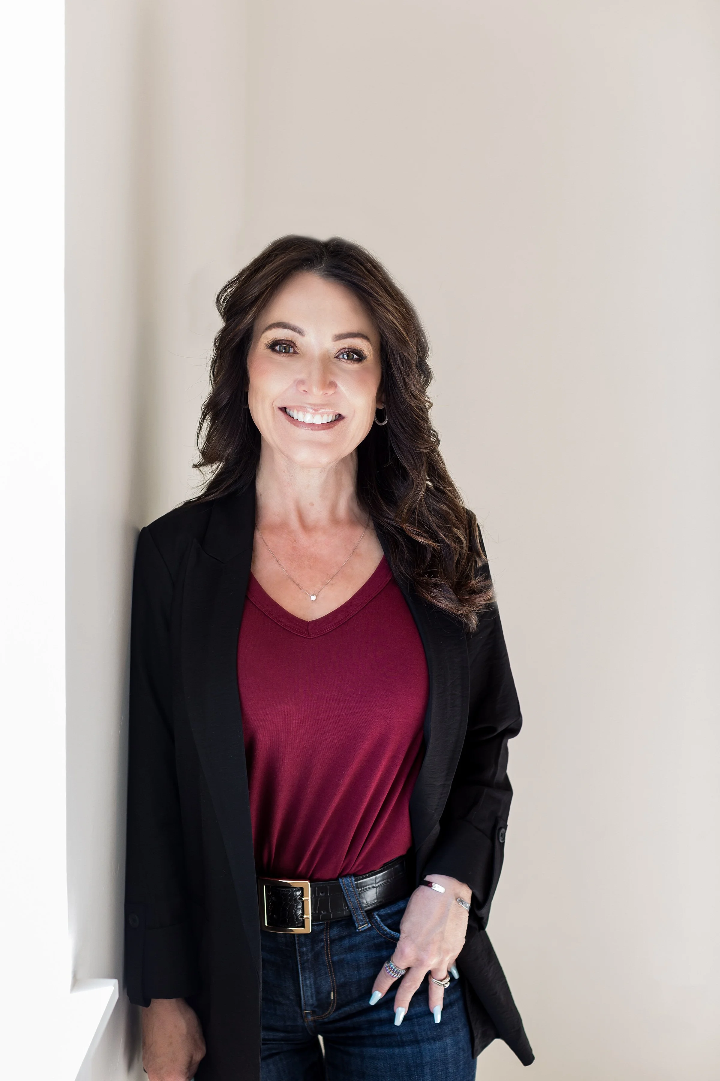 Treasure Valley Idaho Real Estate Agent, Jodi Harada, smiling in the office.