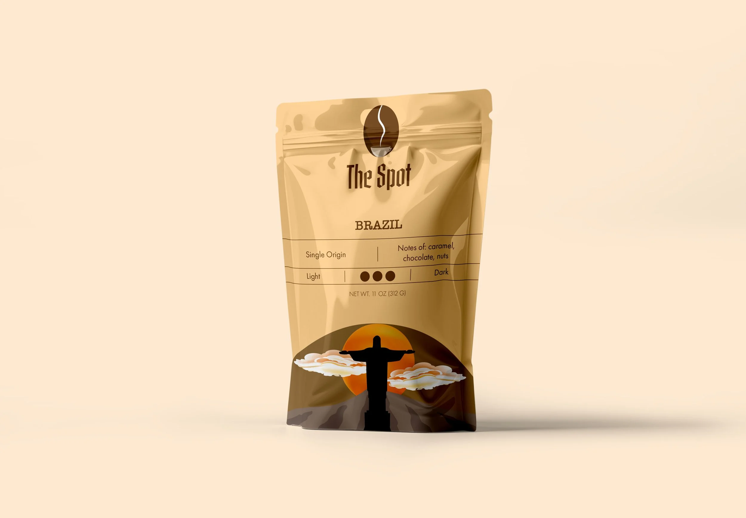 A package of coffee named 'The Spot' with a silhouette of Christ the Redeemer statue at sunset on the front, labeled as originating from Brazil, with notes of caramel, chocolate, and nuts.