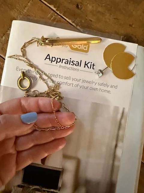 Smartphone displaying the eBay logo on a wooden surface.