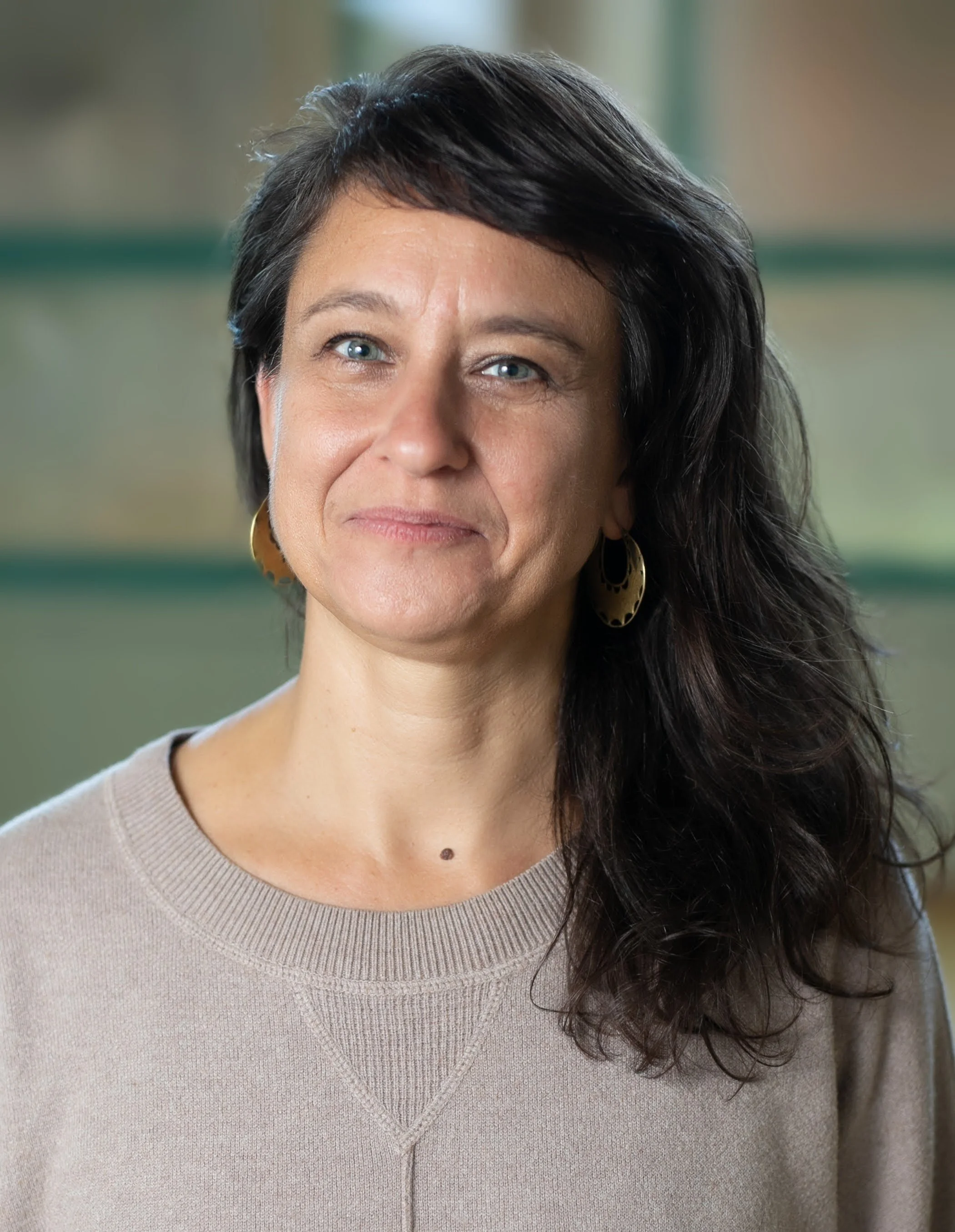 Photo of Julie with long brown hair over her left shoulder