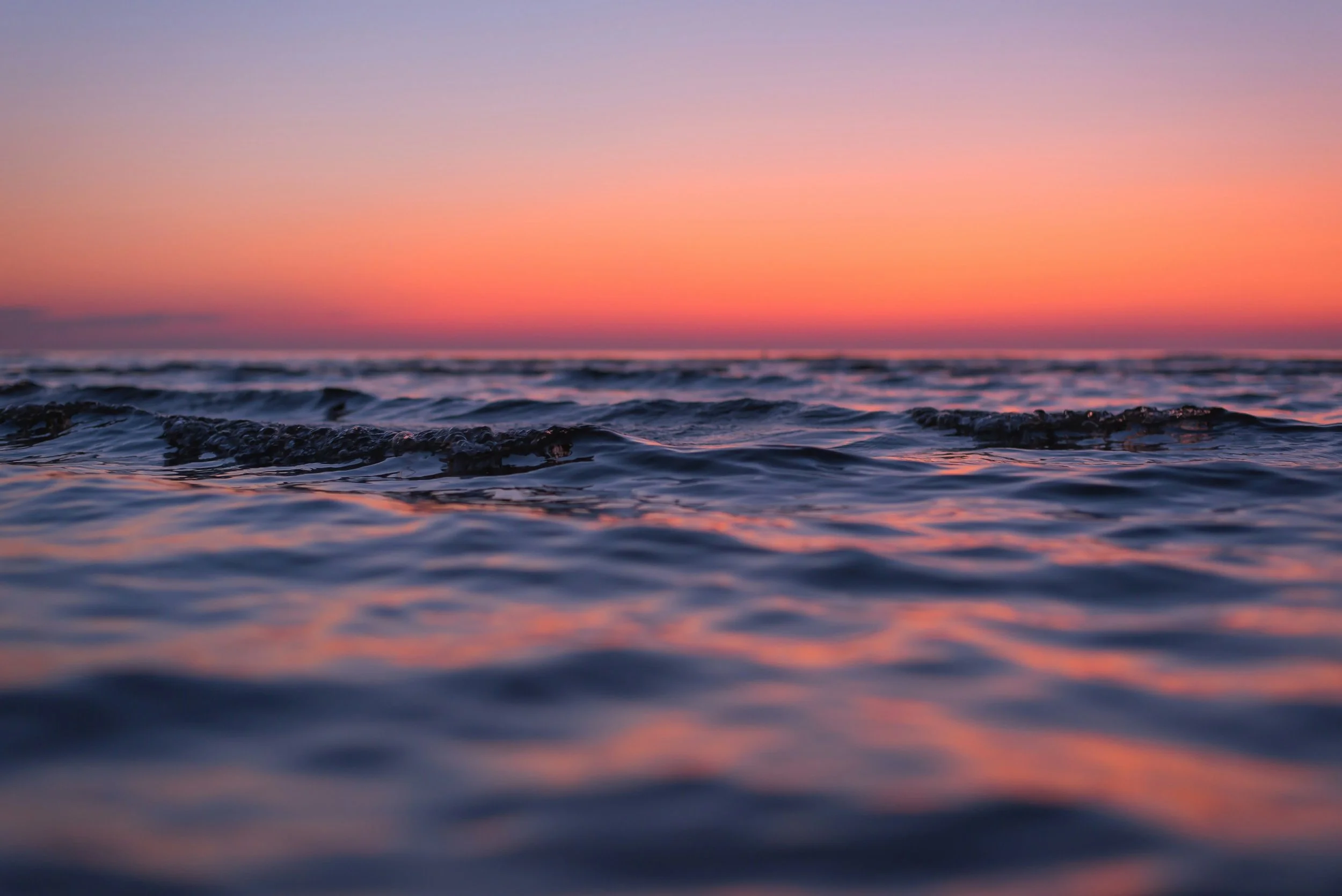 A body of water at sunset reflecting the subtle rhythmic movements of the craniosacral system that biodynamic craniosacral therapy supports through gentle somatic bodywork.