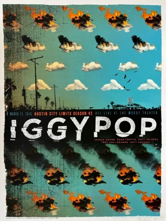 A poster for the play 'Iggy Pop' features a background with a sky of clouds and flames, and silhouettes of trees, power lines, and birds, with text details about the show.