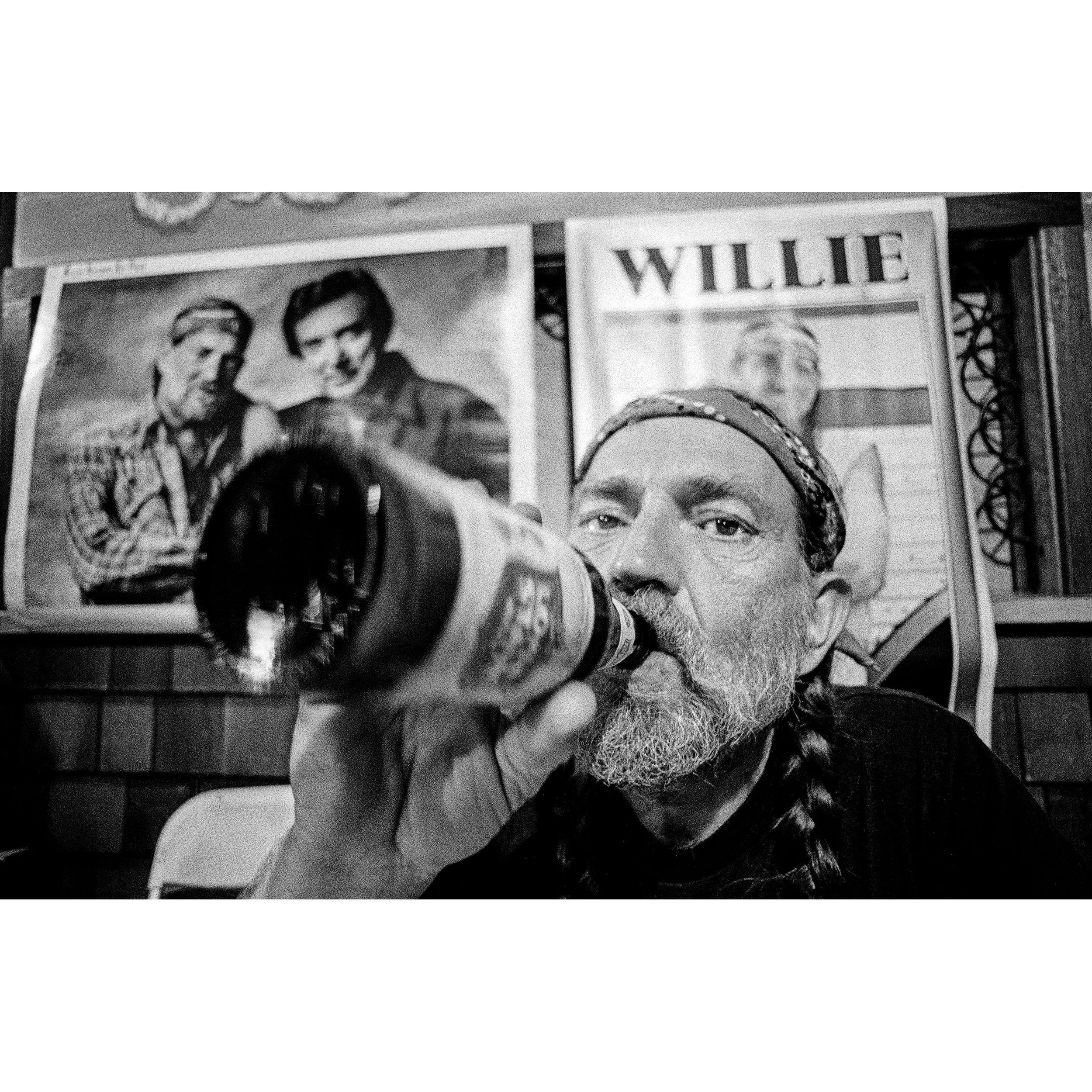 Willie Nelson, Drinking a Lone Star, 1978 by Jay Dickman