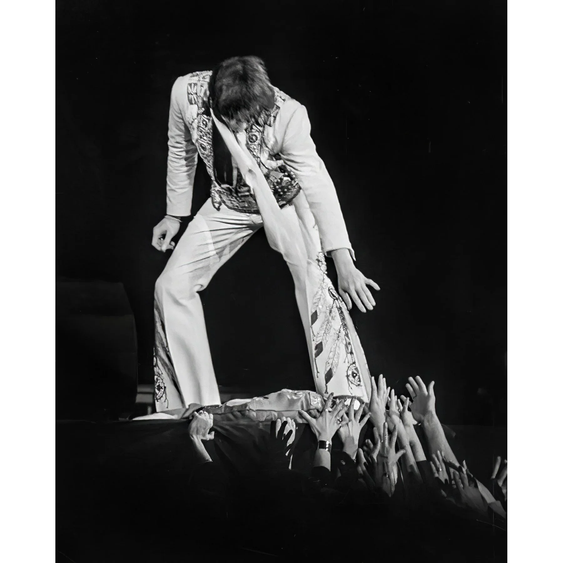 Elvis Presley, Reaching down to the crowd by Jay Dickman