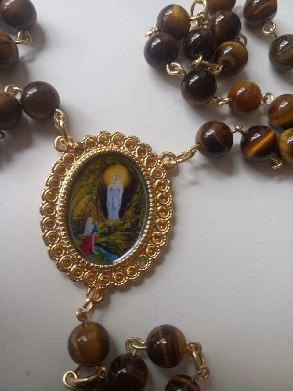 N S Lourdes ´olho de tigre medalha.jpeg