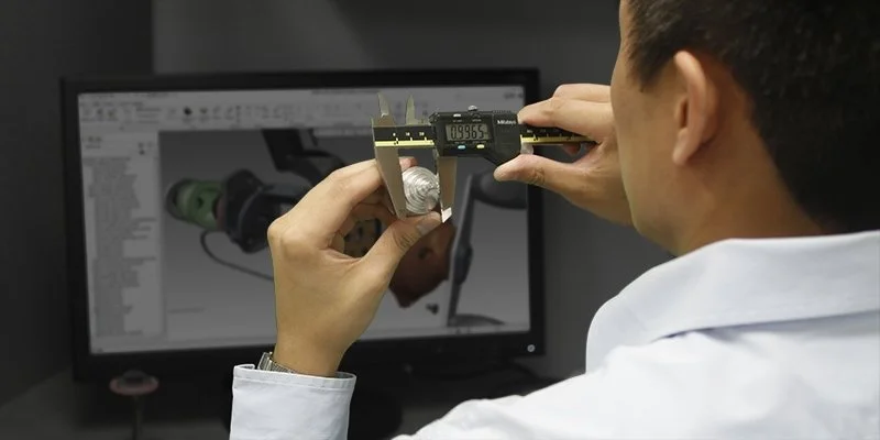 Engineer evaluating a mechanism