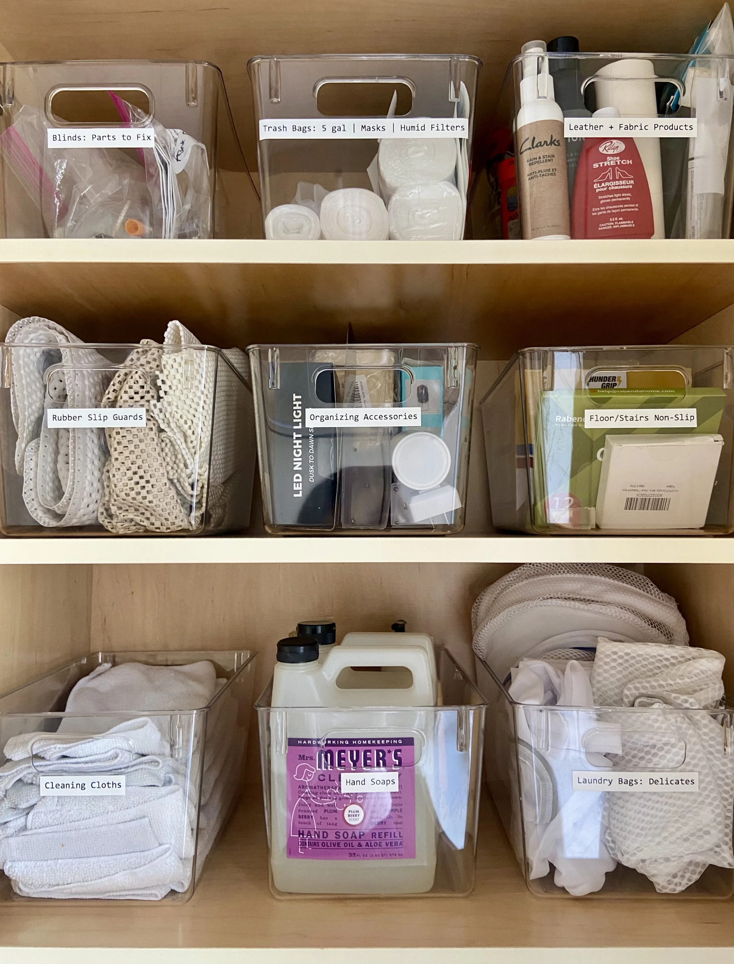 A stylish room with a long storage dresser, playful wall art, a cozy shag carpet, and a simple window plant that adds warmth to the minimalist look.