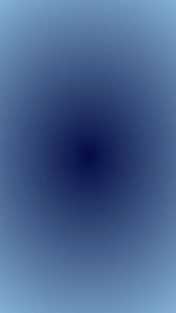 Abstract blue gradient background with a dark central spot
