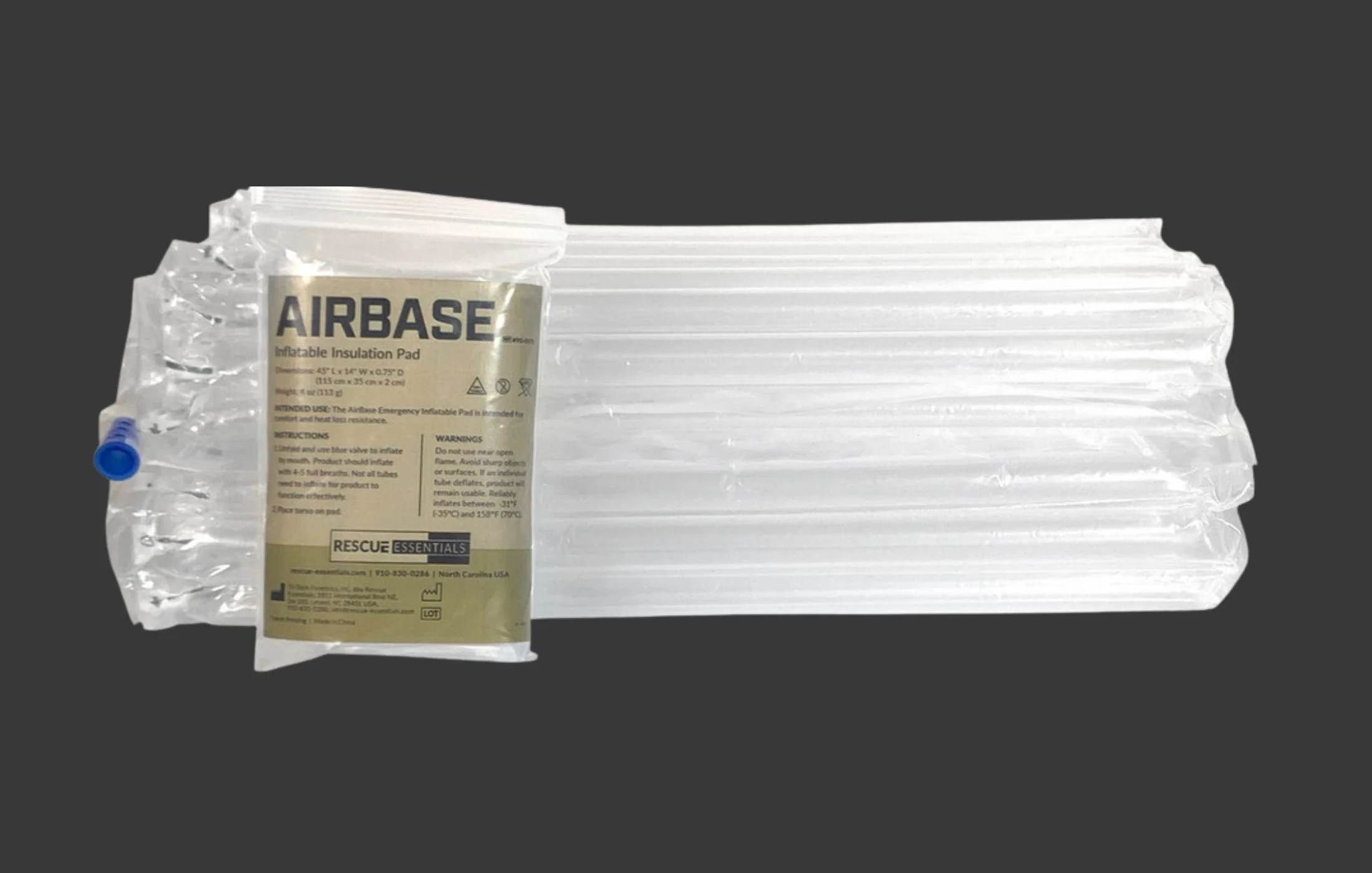 A stack of empty inflatable emergency evacuation pads with one deflated pad labeled 'AIRBASE' in front.