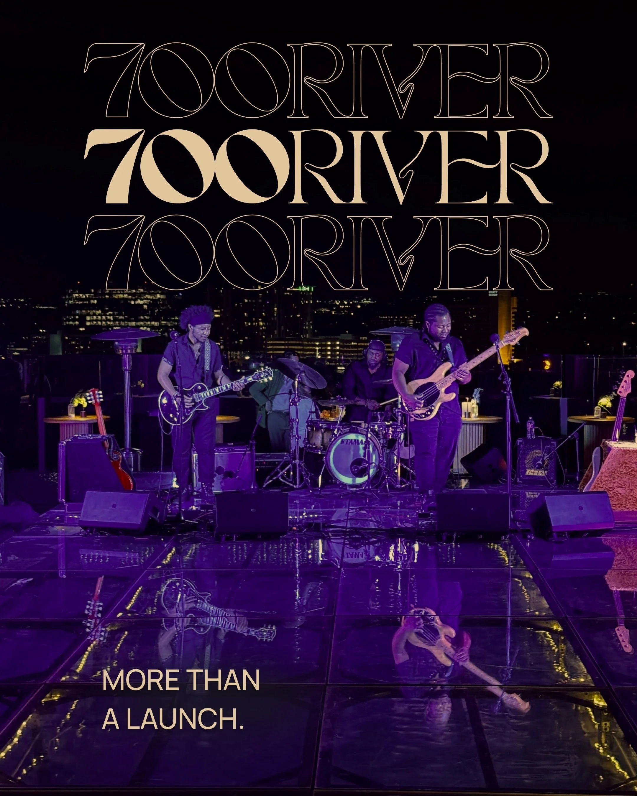 A band performing on a rooftop at night with city lights in the background. There are three musicians with guitars and a drummer, and large stylized text overlaying the image reads '700 RIVER' three times. The caption at the bottom says, 'MORE THAN A LAUNCH.'