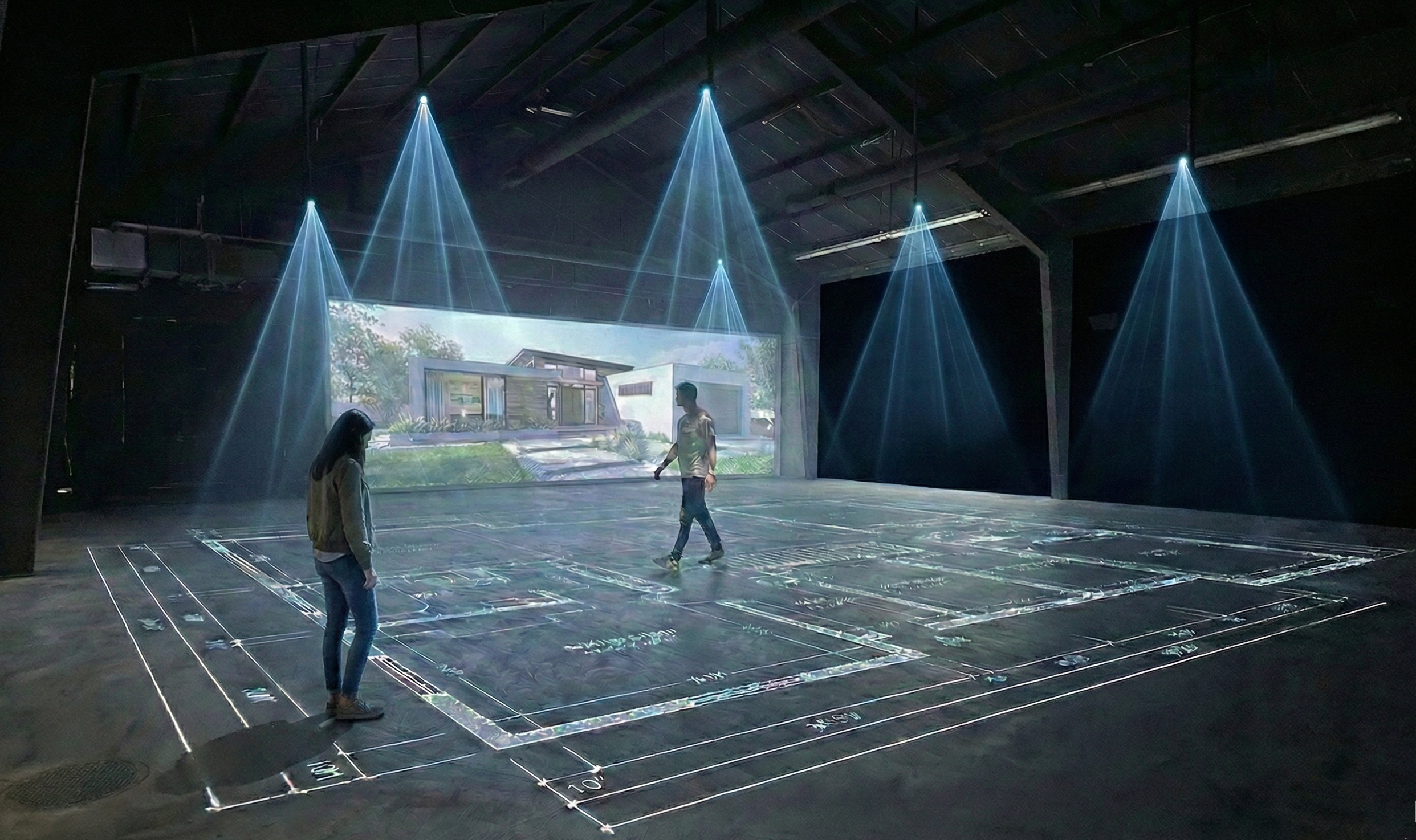 Indoor space with projected architectural plans and a computer-generated model of a modern house on a large screen. Two people are observing the display, and blue spotlights illuminate the area.
