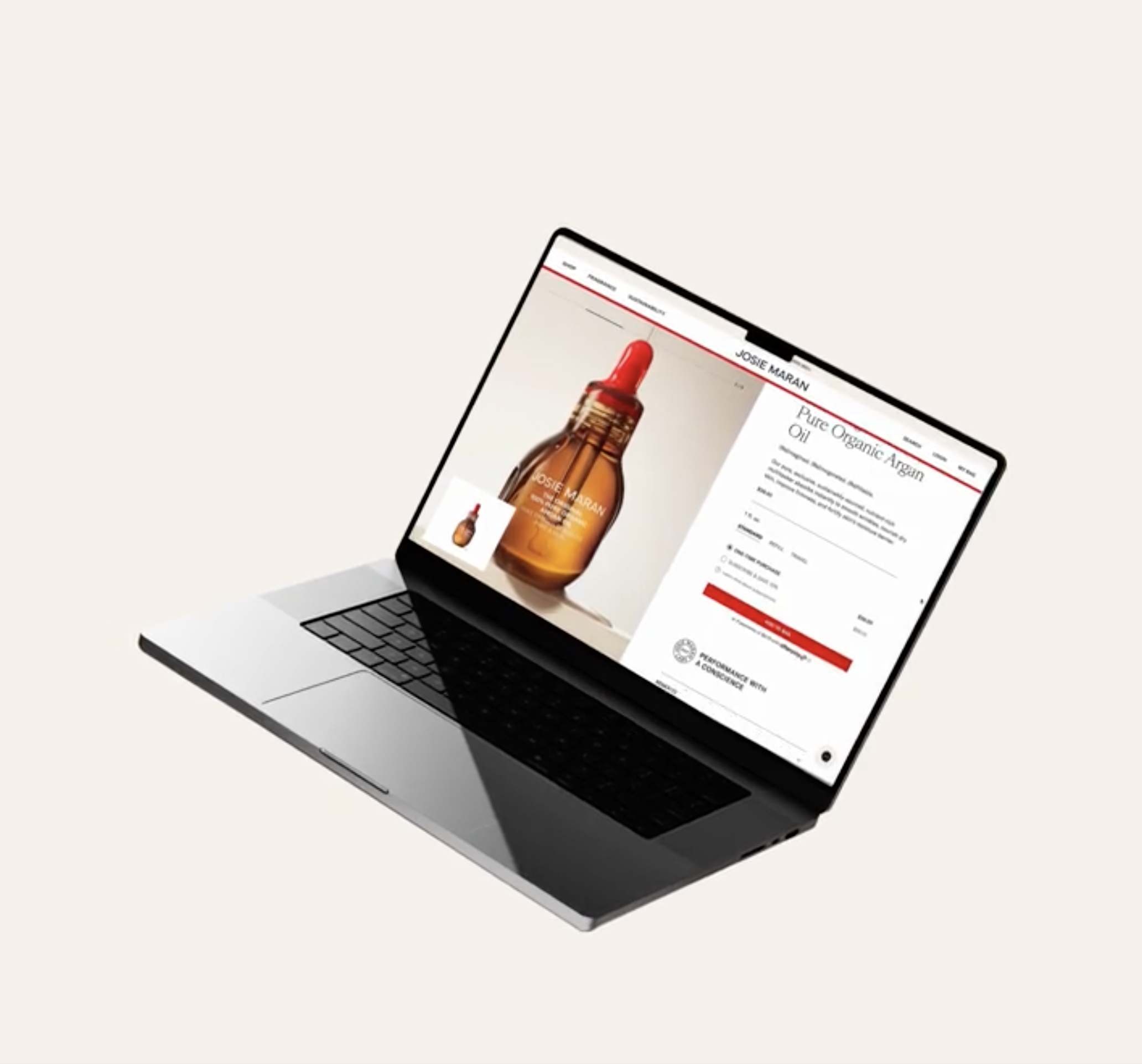 Open laptop displaying an online product page for Josie Maran pure organic argan oil, featuring a large image of a brown glass bottle with a red dropper cap.