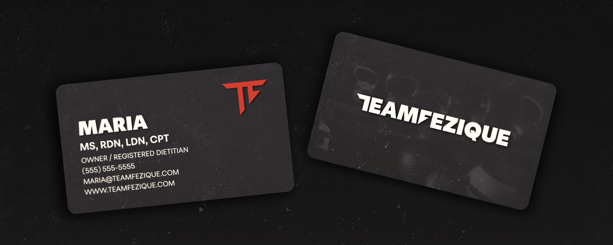 Business cards for Maria and Team Fezique, on a dark background.