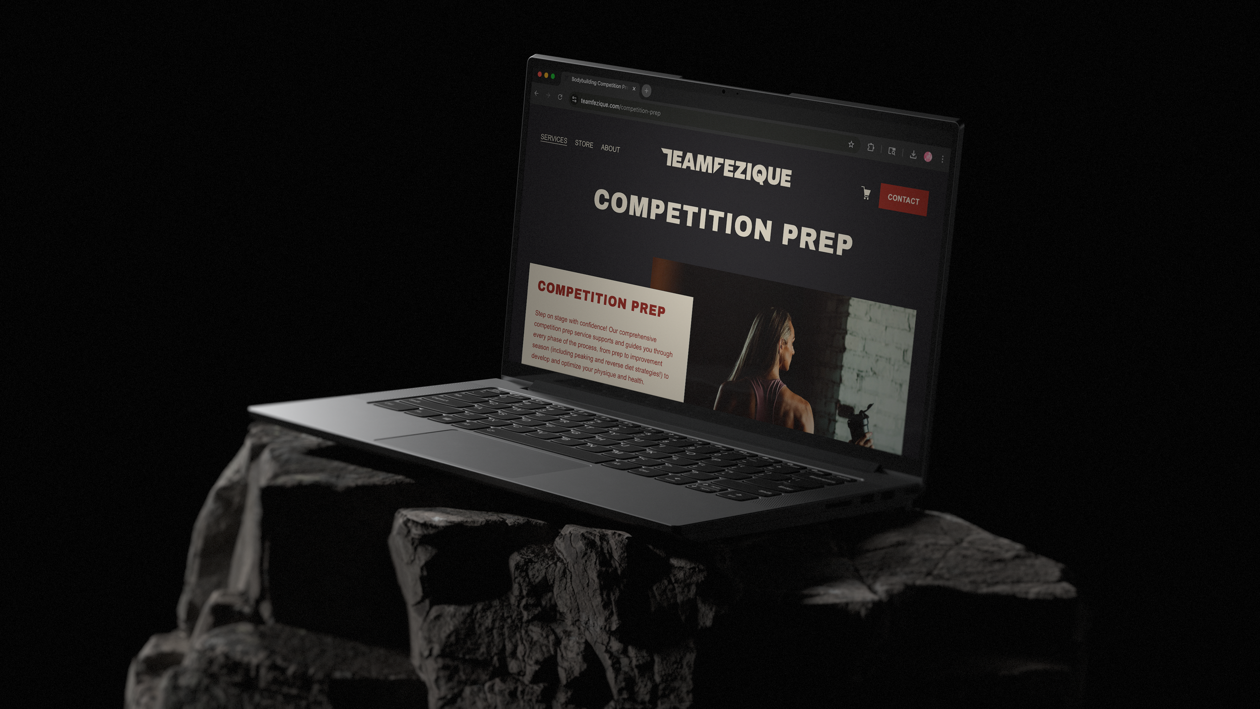 A laptop displaying a website for workout competition preparation, placed on a rock against a dark background.