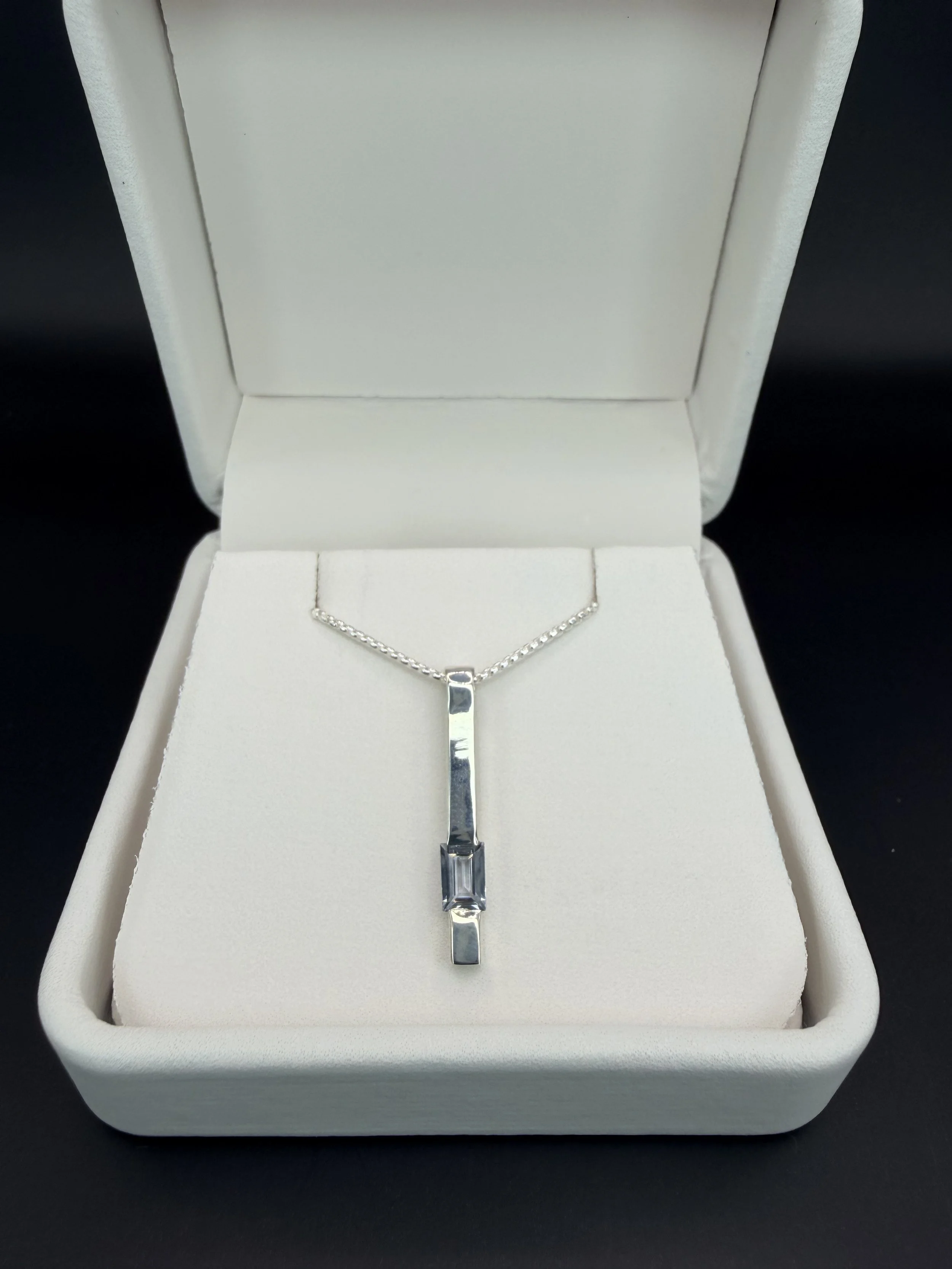 Sterling Bar Pendant with Light Blue Emerald Cut Sapphire