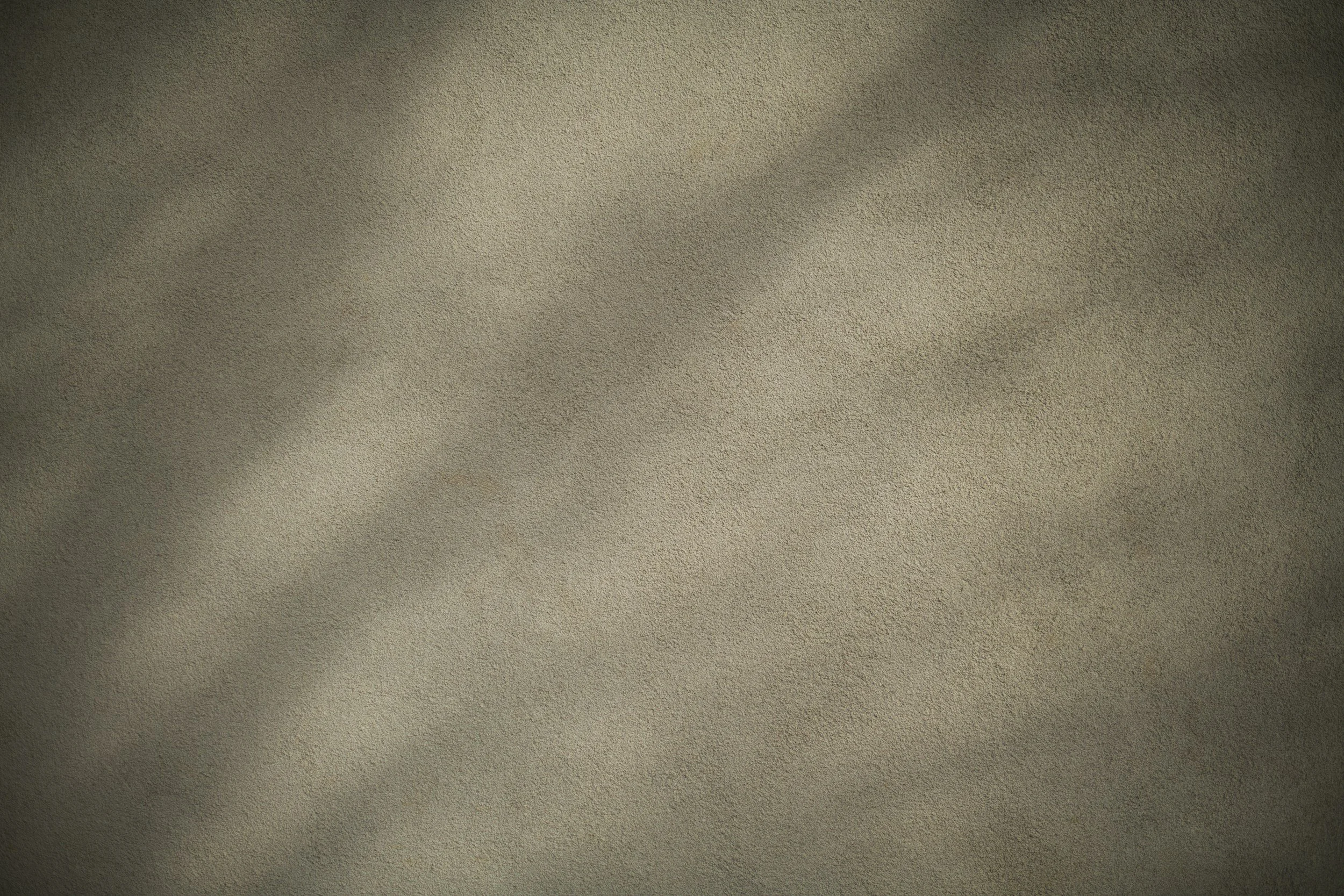Close-up view of a textured ceiling with a small stain or spot near the center.