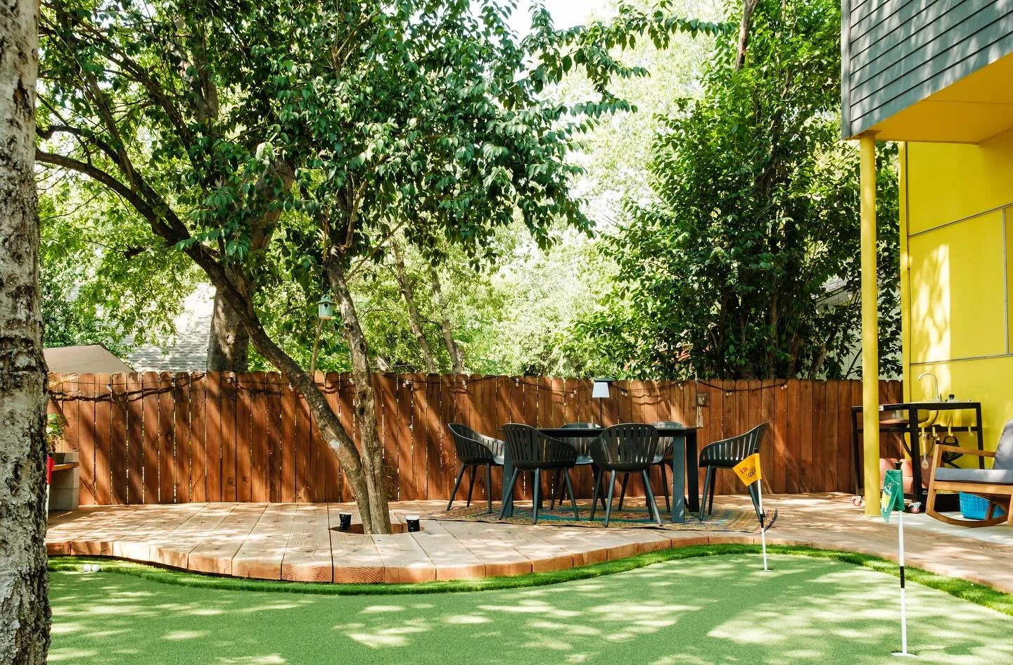 Backyard with a real wood deck and integrated outdoor features built by BigDecks.
