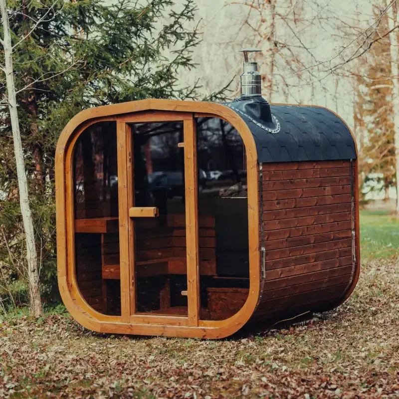 Outdoor wooden sauna installed as part of a backyard build.