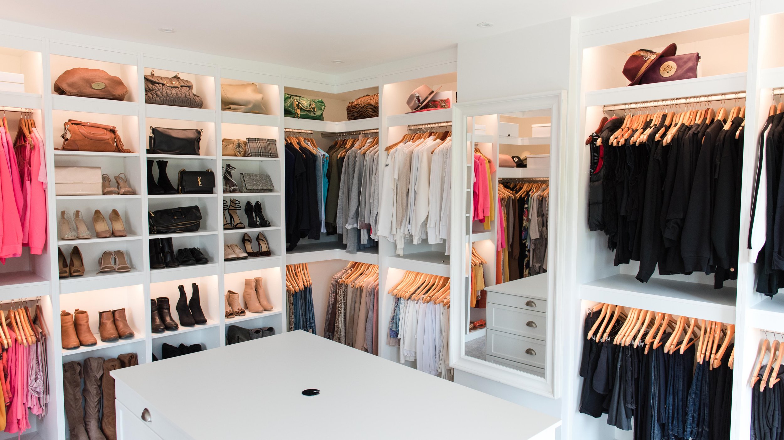 Step 3 organization: a fully organized closet with clothes and shelves neatly arranged.