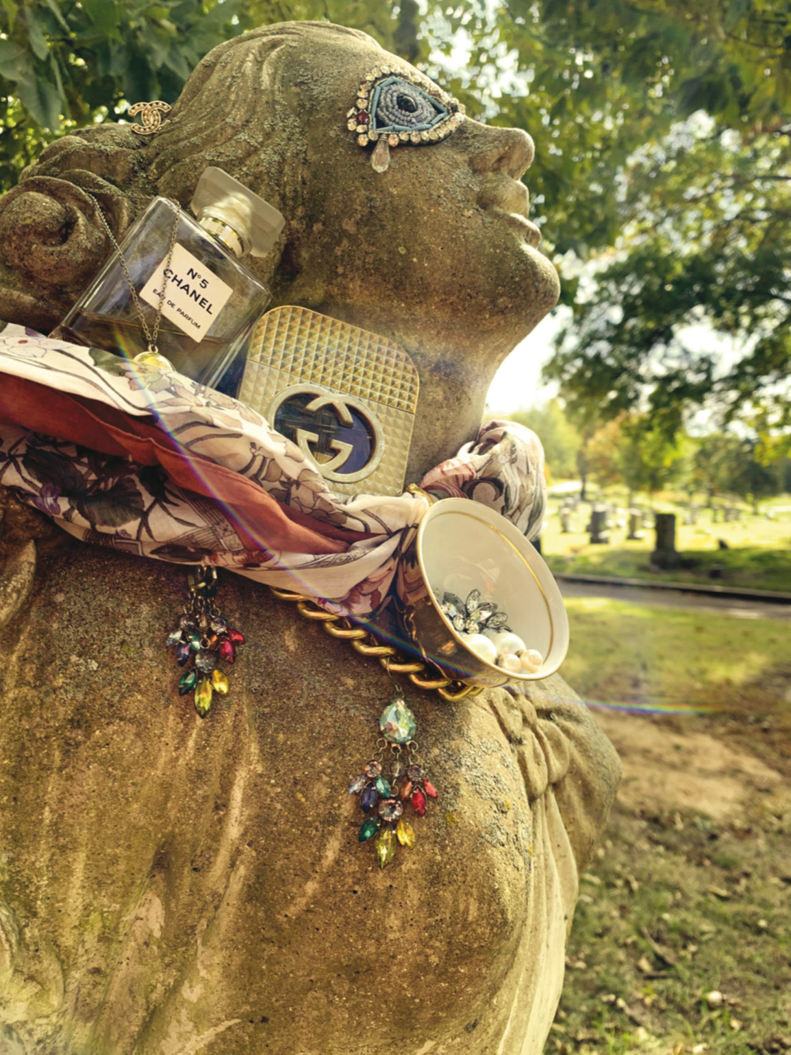 Greed - staged art direction in a cemetery as reminder: we can’t take these objects with us.