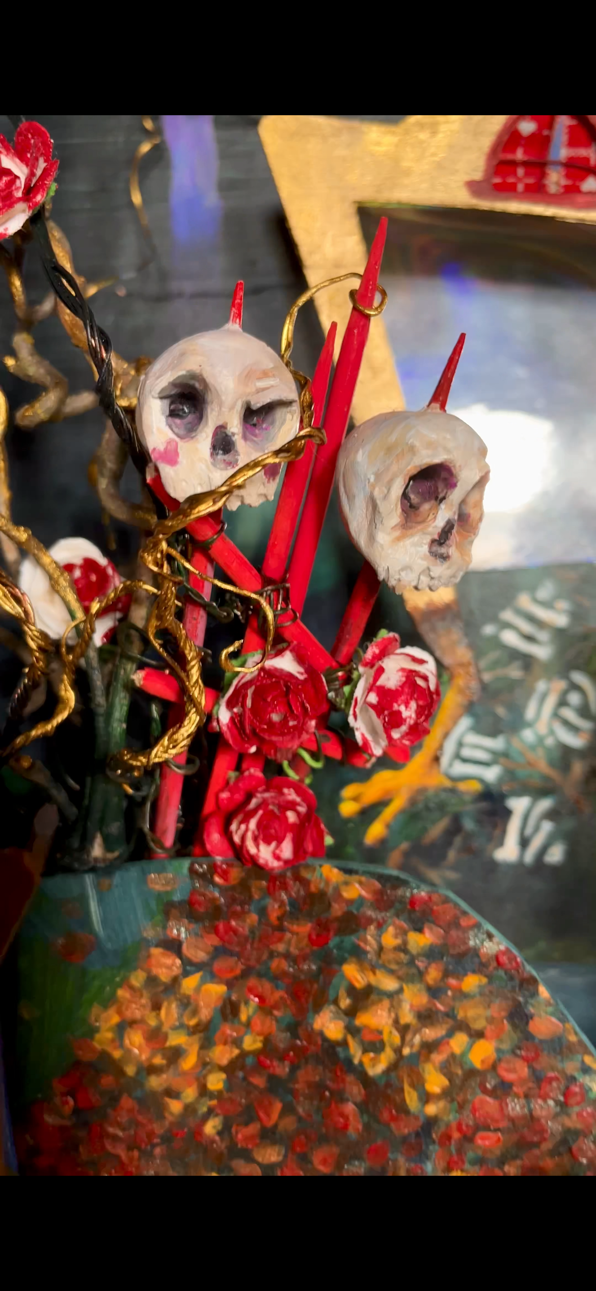 Clay was sculpted, fired and painted to create the fence harkening to Baba Yaga’s house on chicken legs