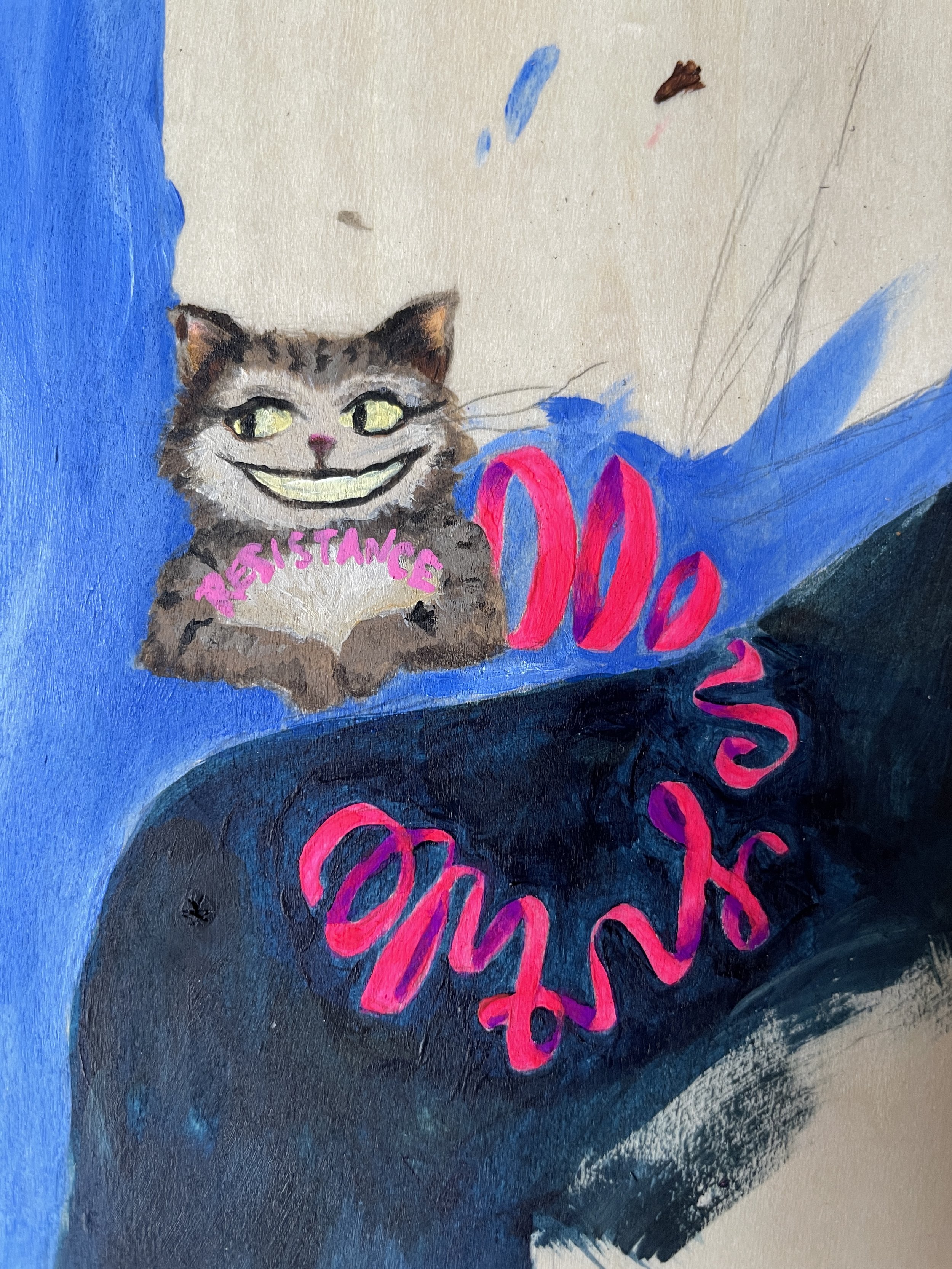 Look closely—the cat’s fur and ribboned tail spell out “resistance is futile”