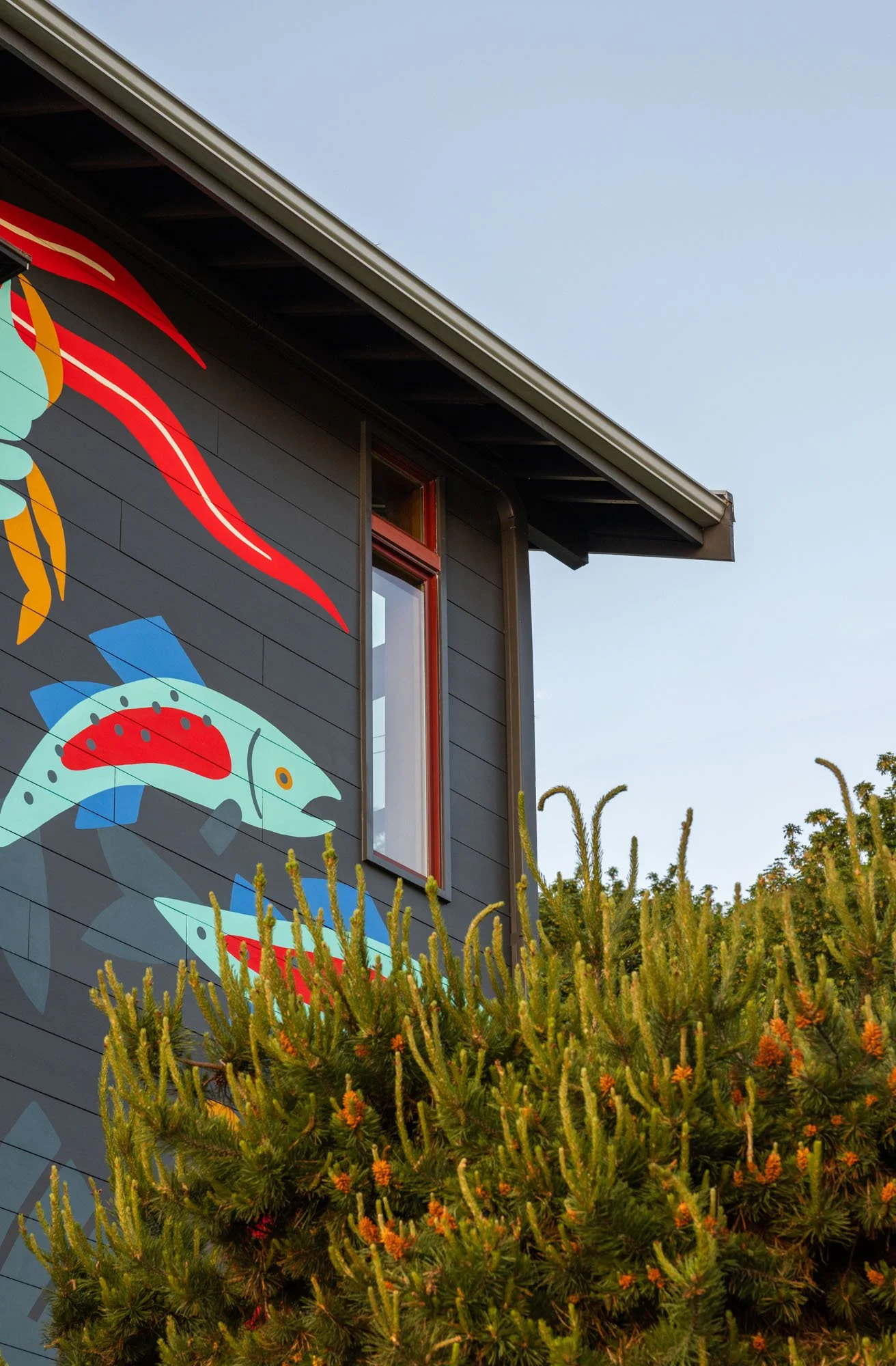 New exterior envelope, including foundation repair, waterproofing, and siding, with mural by Stevie Shao.