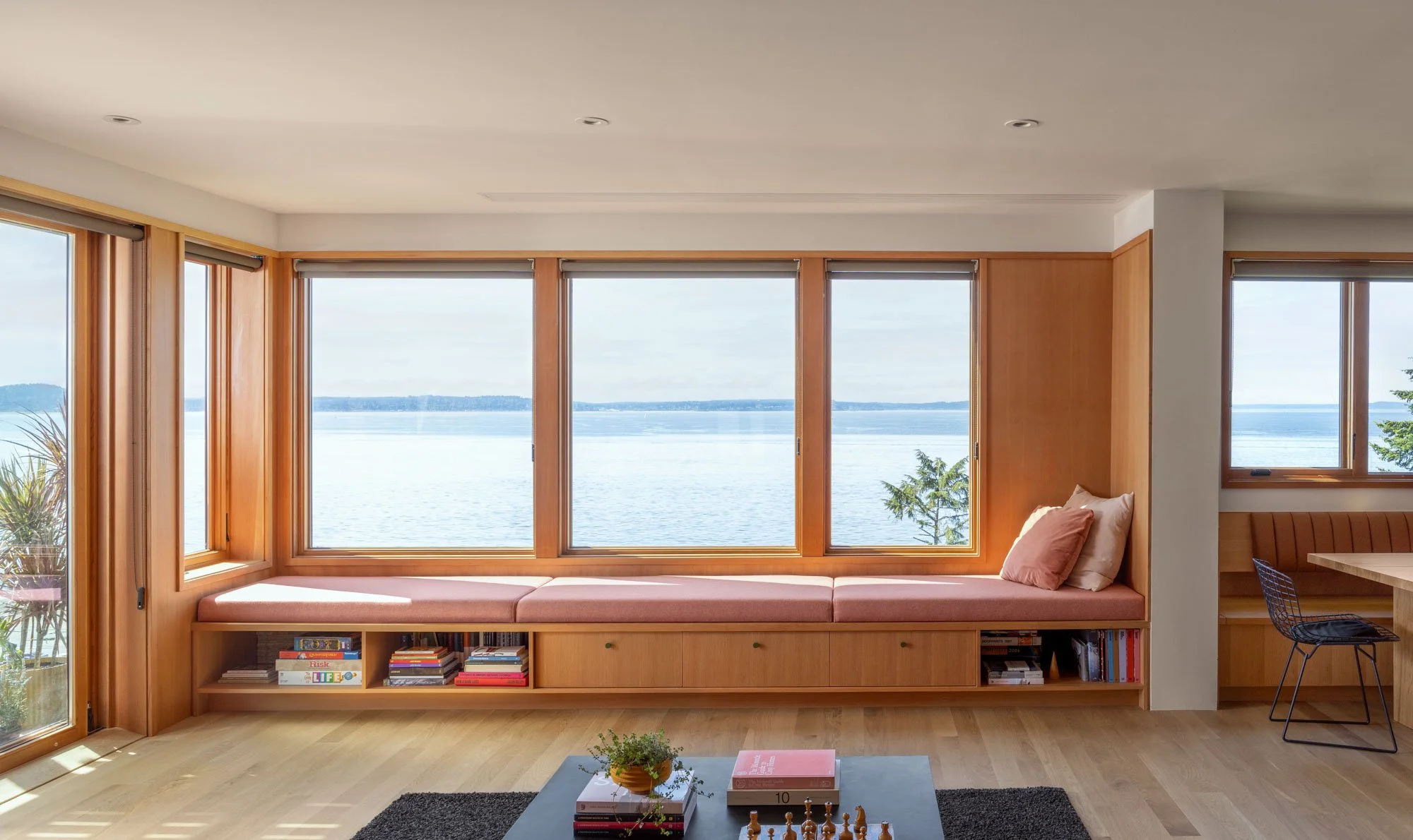 Remodeled living room with custom window bench made in the Bucktide woodshop.