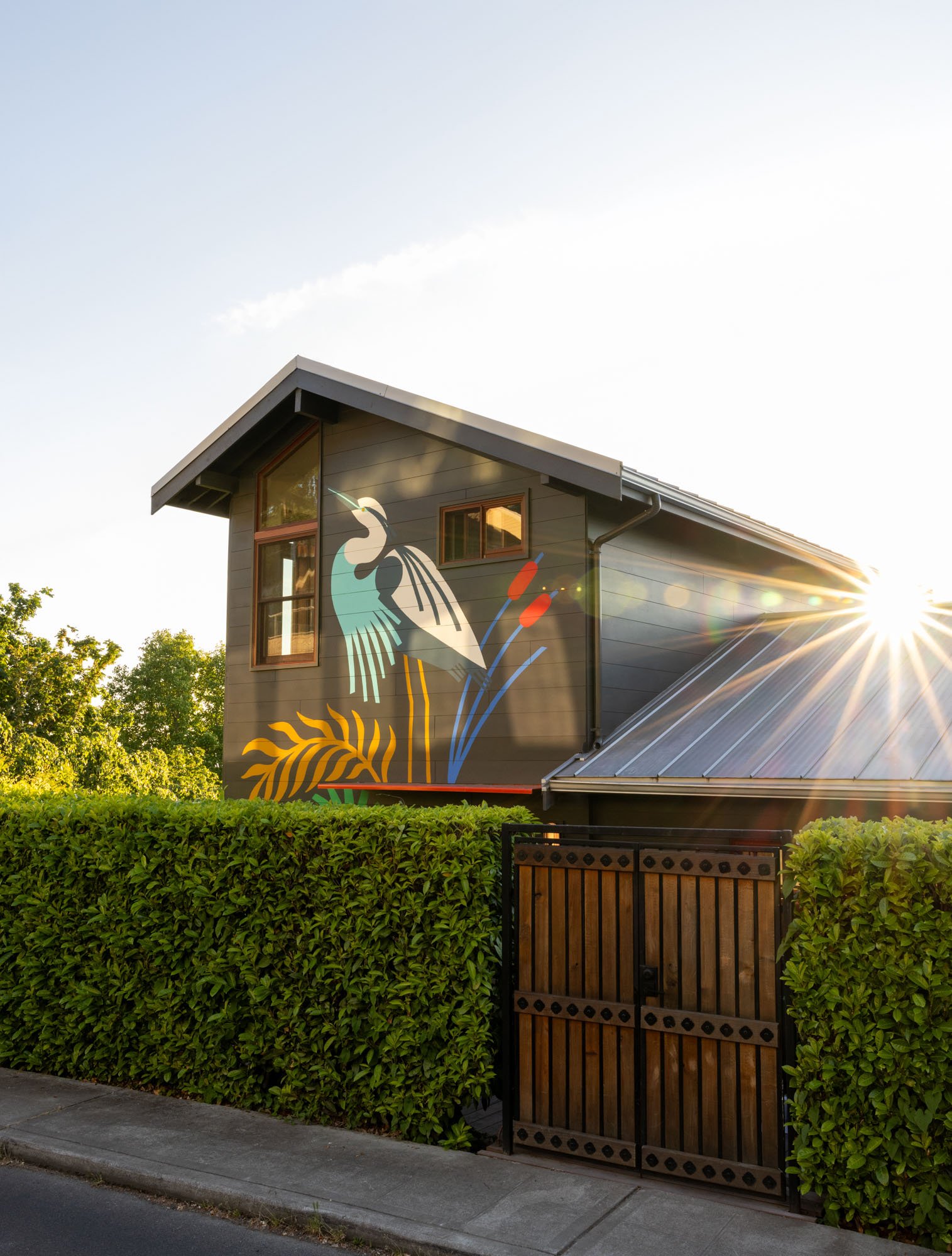 New exterior envelope, including foundation repair, waterproofing, and siding, with mural by Stevie Shao.