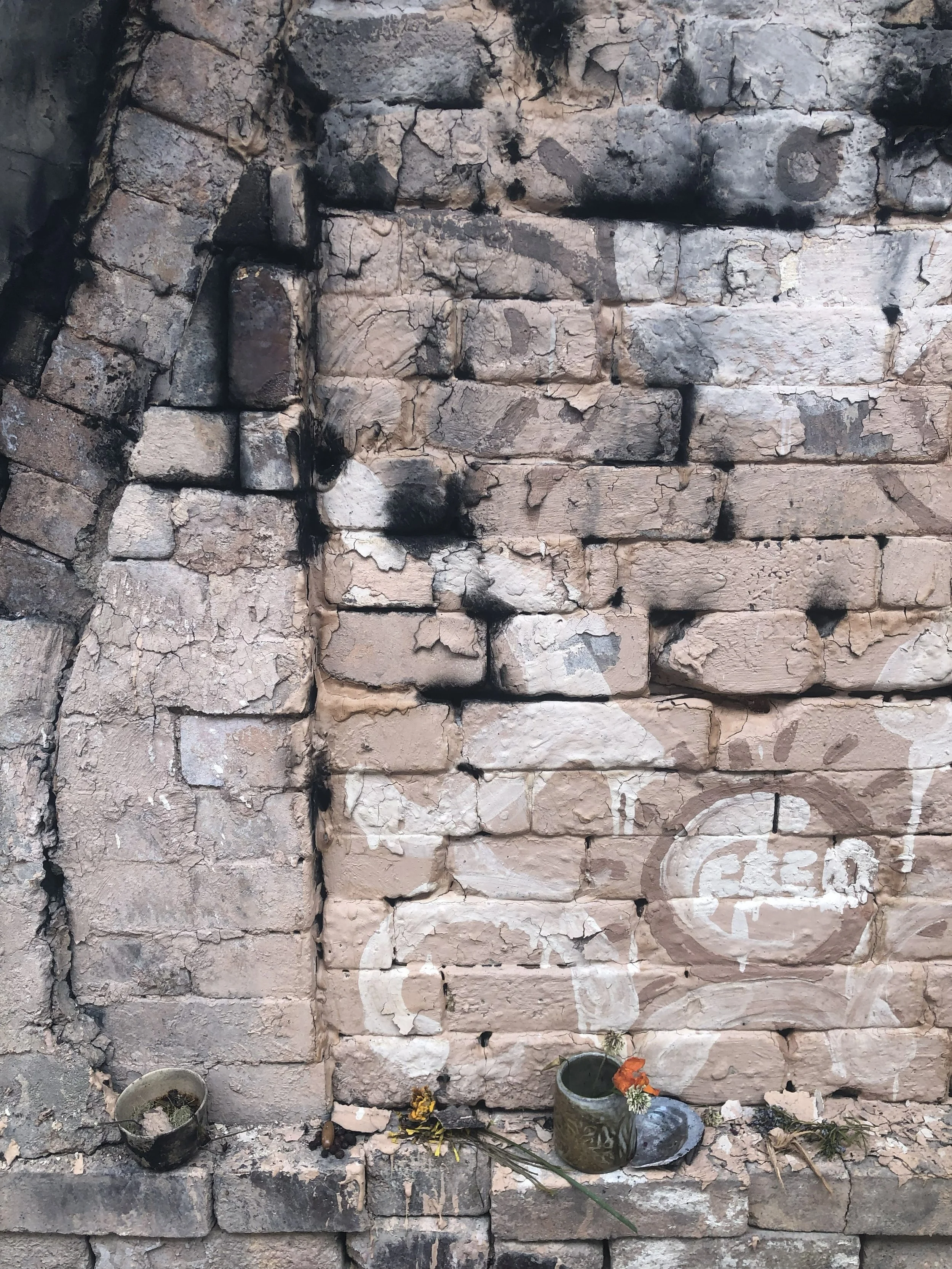 kiln offerings shared by community members. Painted door adorned with 'Fred', after my late grandfather who passed around this time