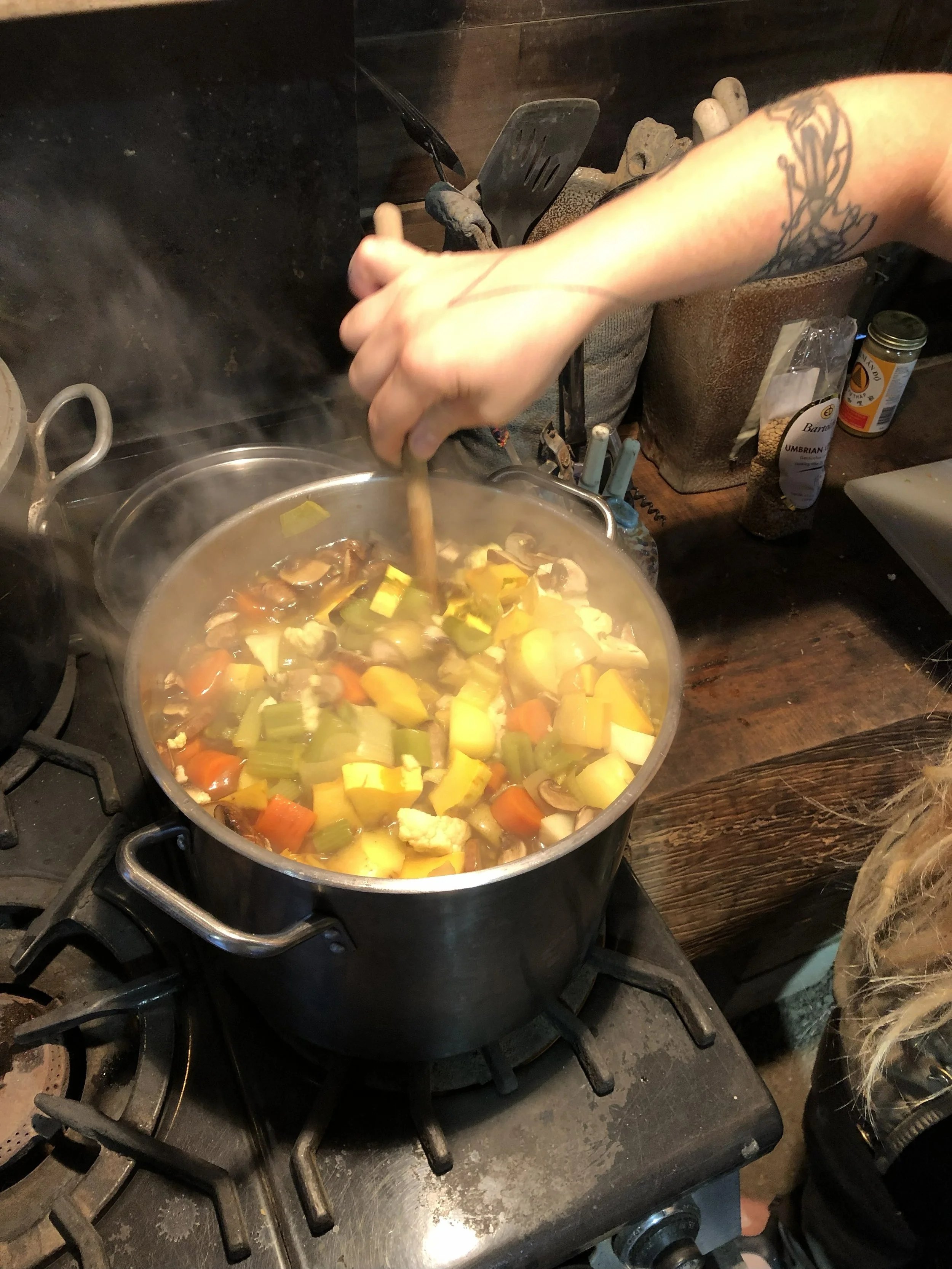 Katie cookin up veggie soup of course