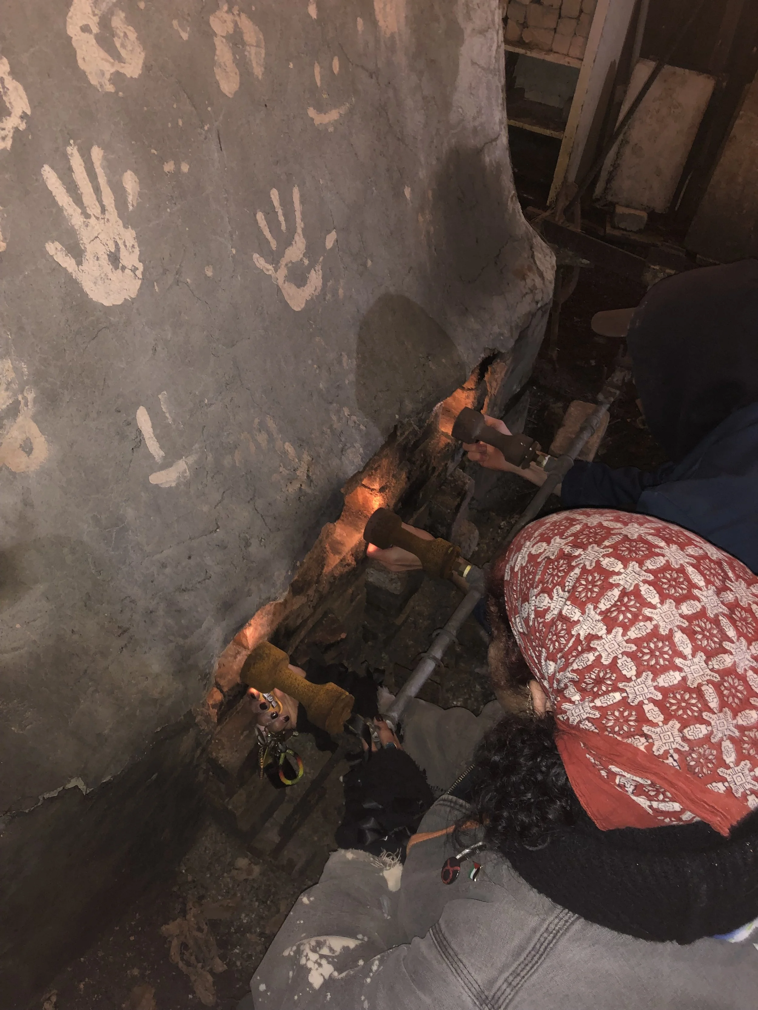 Zahra and Hallie lighting the kiln