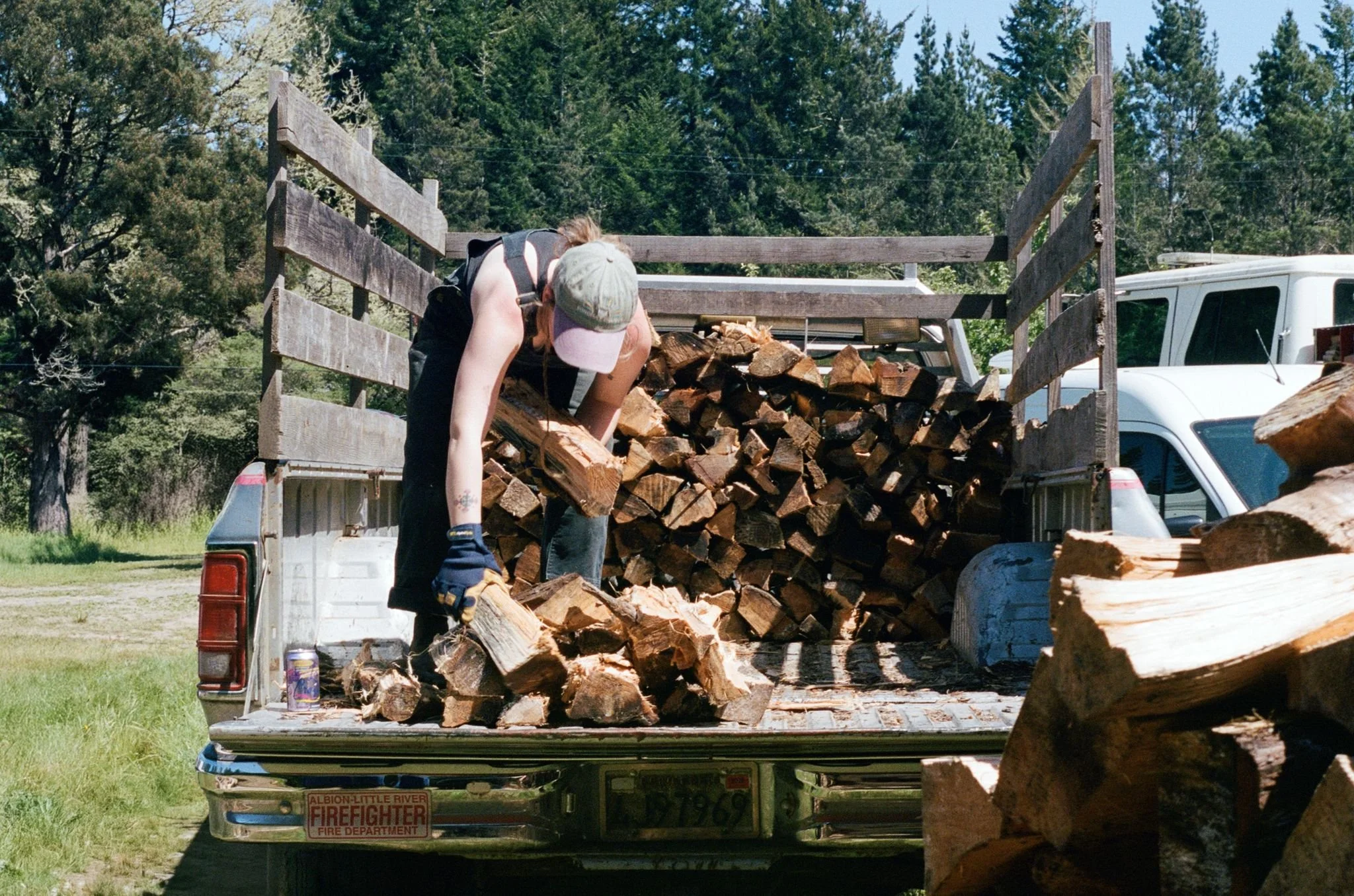 Meg unloading wood off of Nick's truck. Photo by Katie Goode Donaldson.