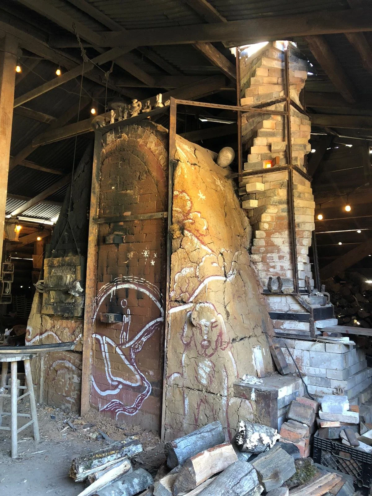 Our kiln. Dog drawings by Jess, door painted by Jules