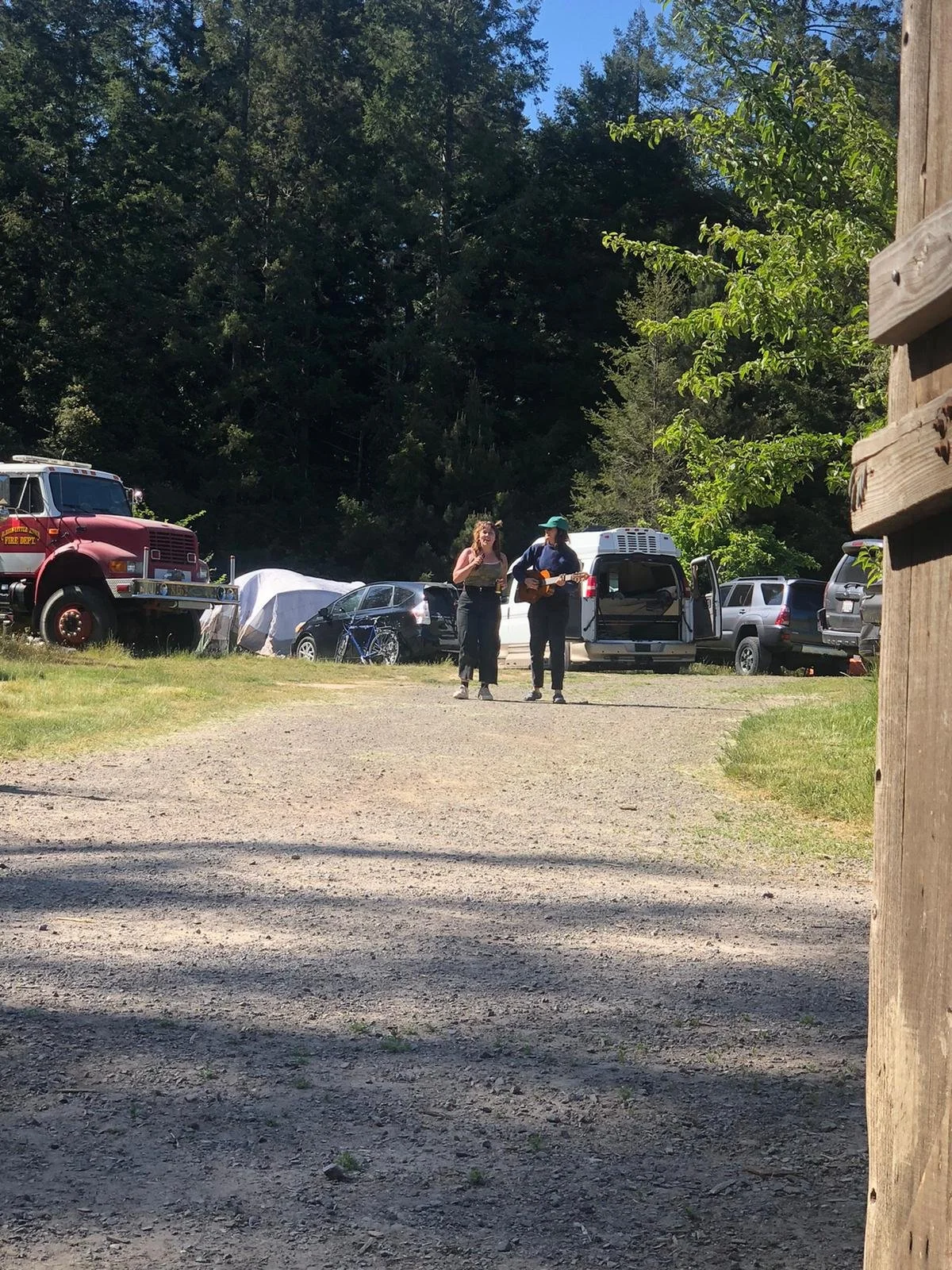 Azelia and Lexi singing songs in the parking lot
