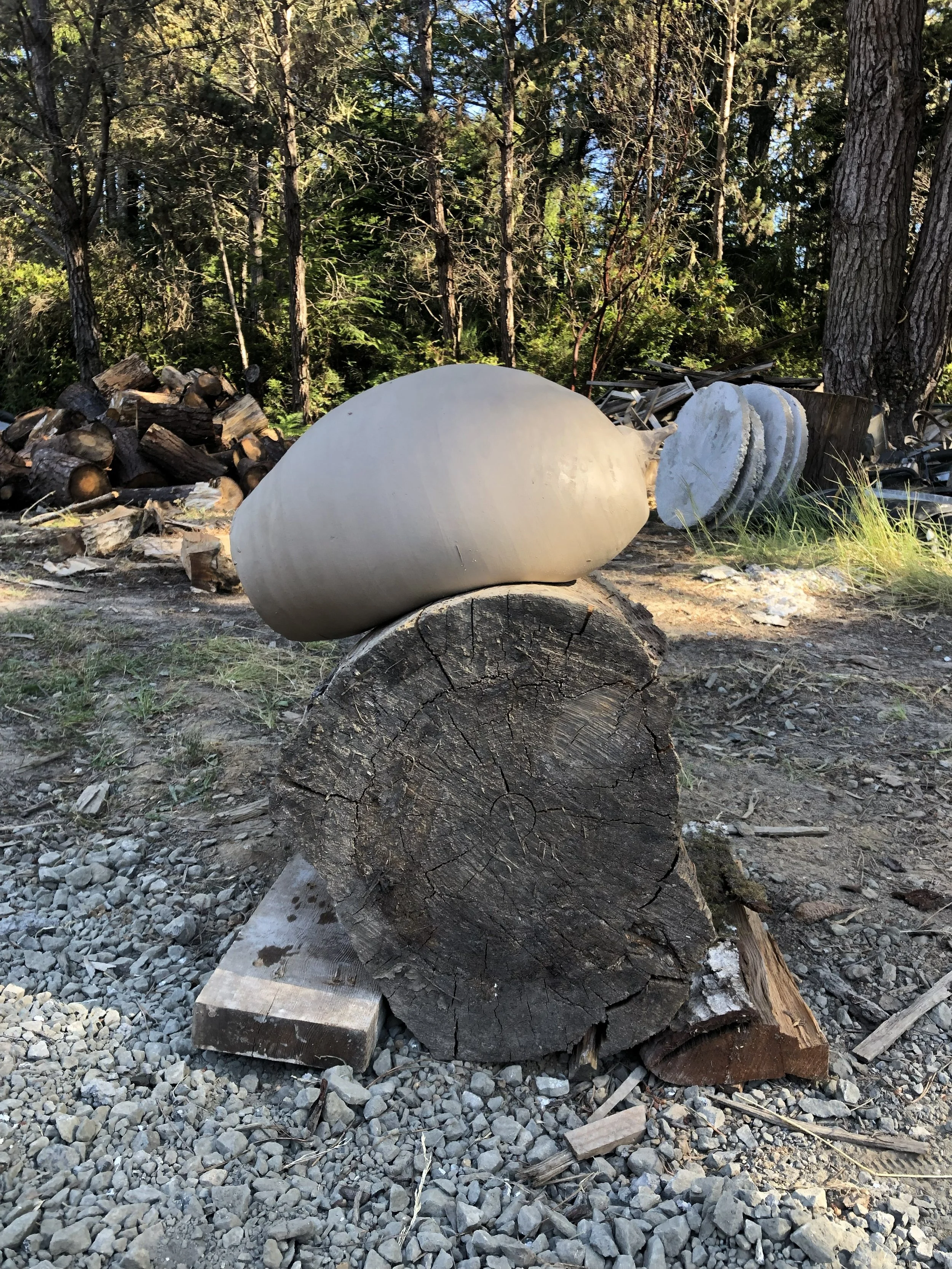 Kiln whistle drying over log form