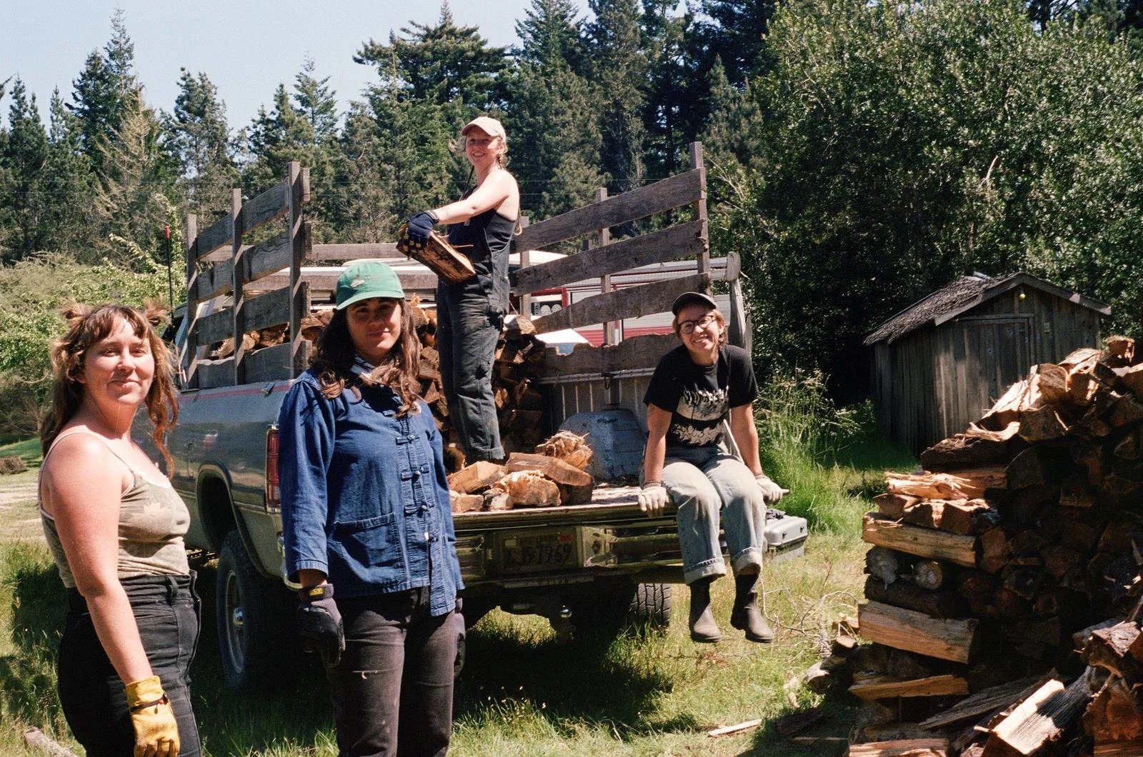 Azelia, Lexi, Meg, & Jules unloading wood from Nick's truck. 
Photo by Katie Goode Donaldson