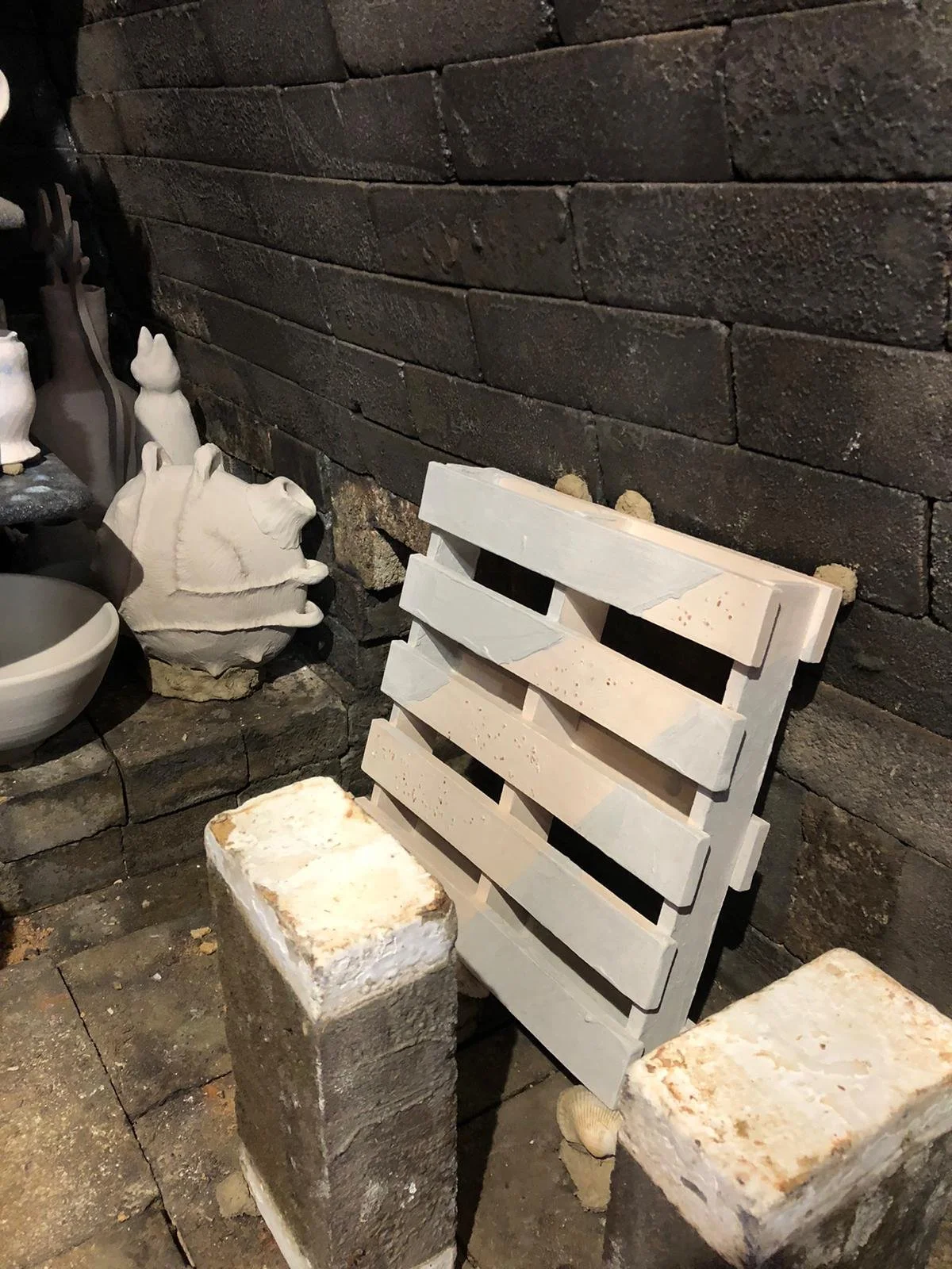 Charley's pallet on the kiln wall