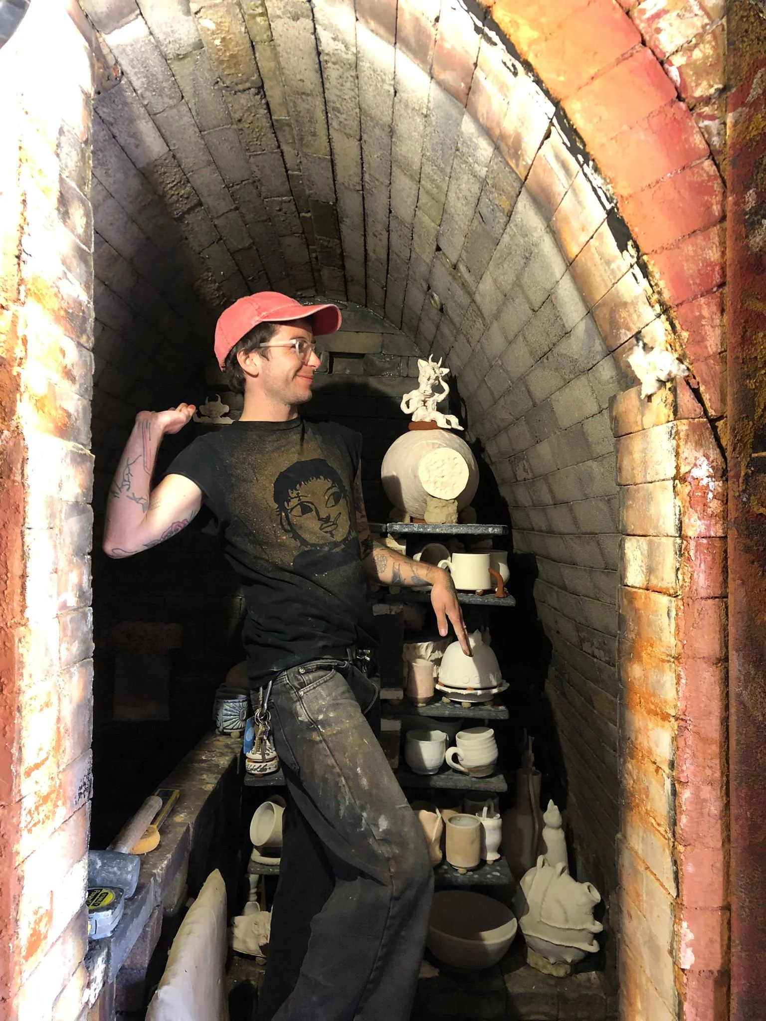 Dan mimicking Azelia's creature/kiln god