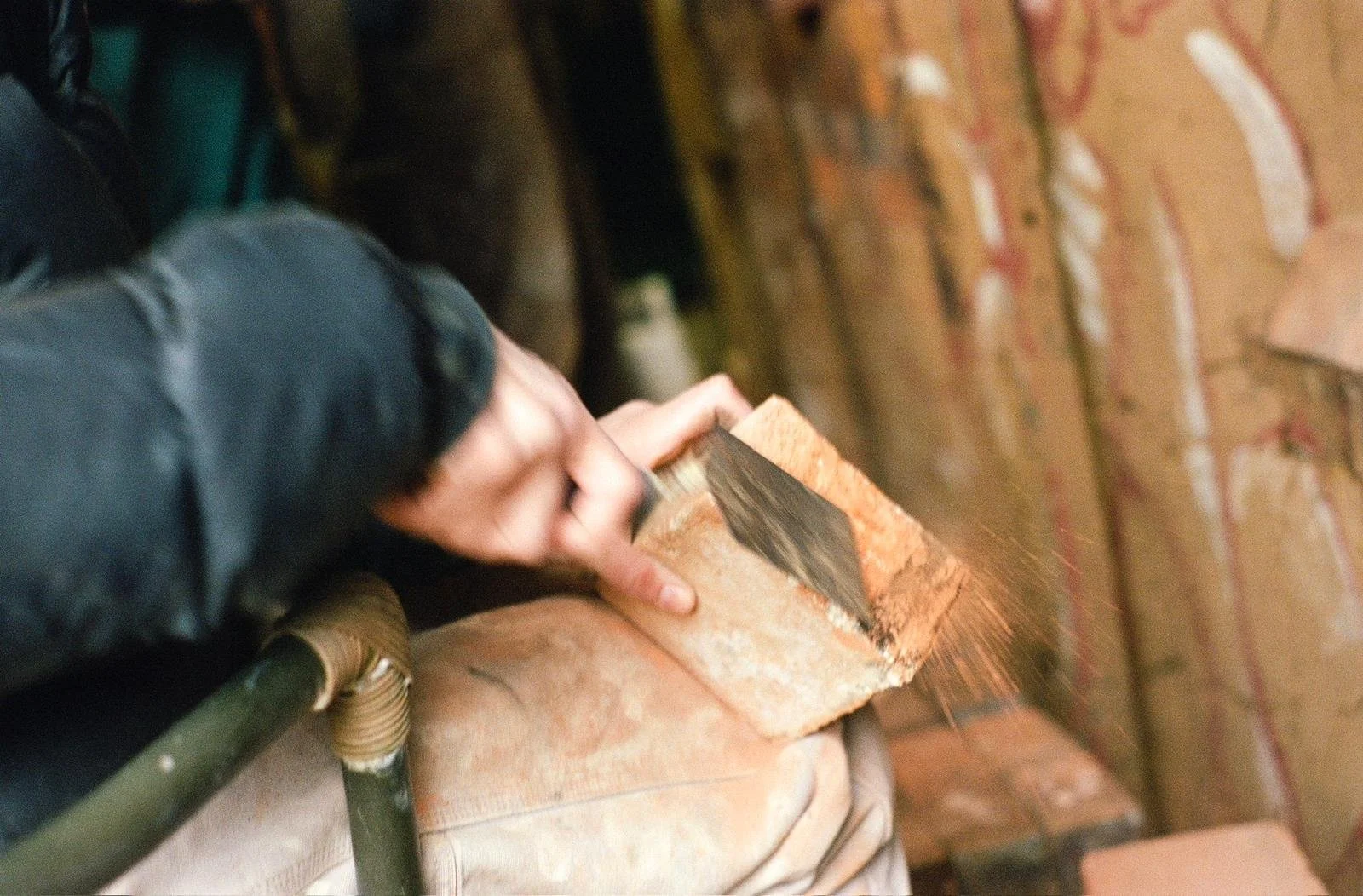 Nick demoing how to scrape bricks. Photo by Katie Goode Donaldson