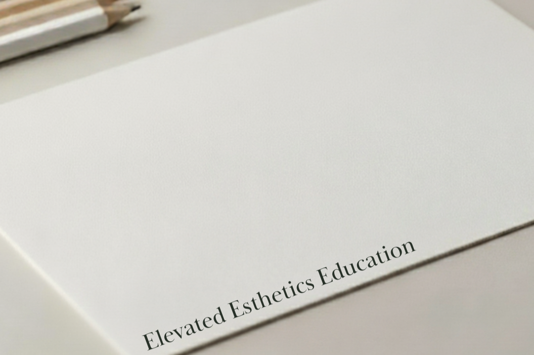 Close-up of a white paper with the text 'Elevated Esthetics Education' printed on the bottom right corner.
