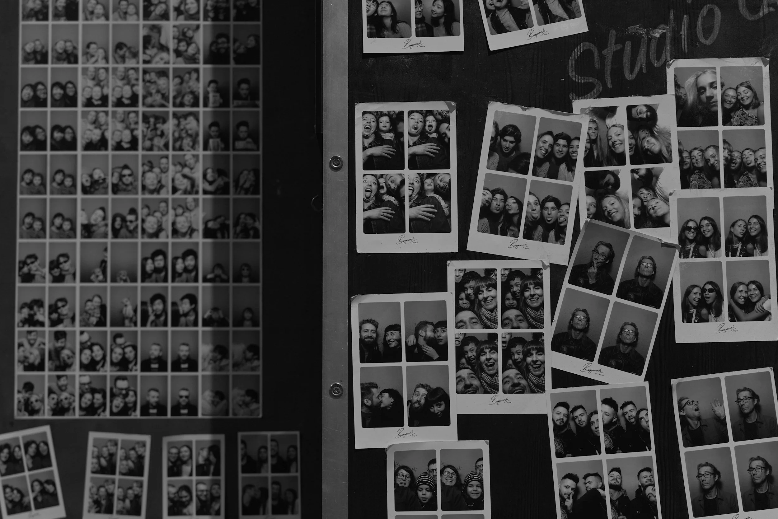Black and white photographs of groups of people arranged on a display board.