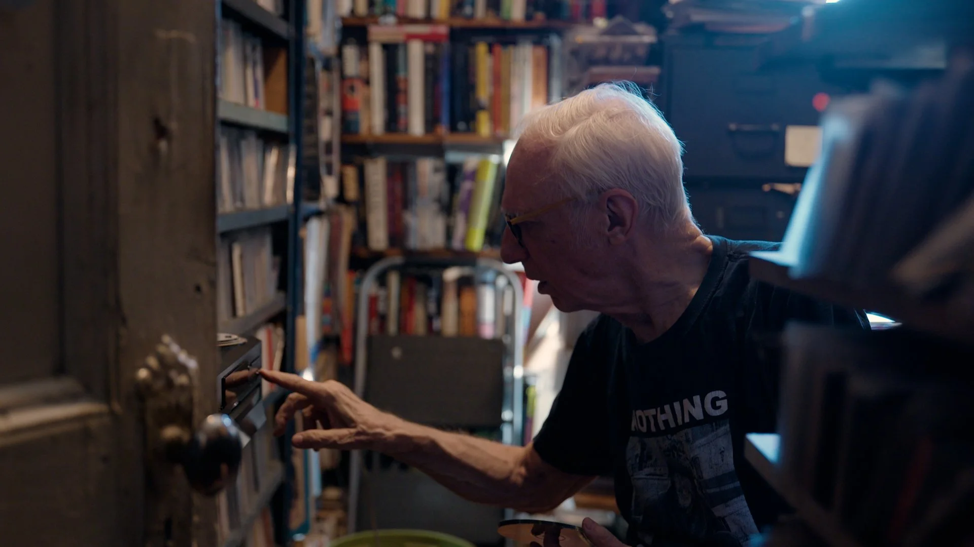 Robert Christgau fiddling with his CD changer.