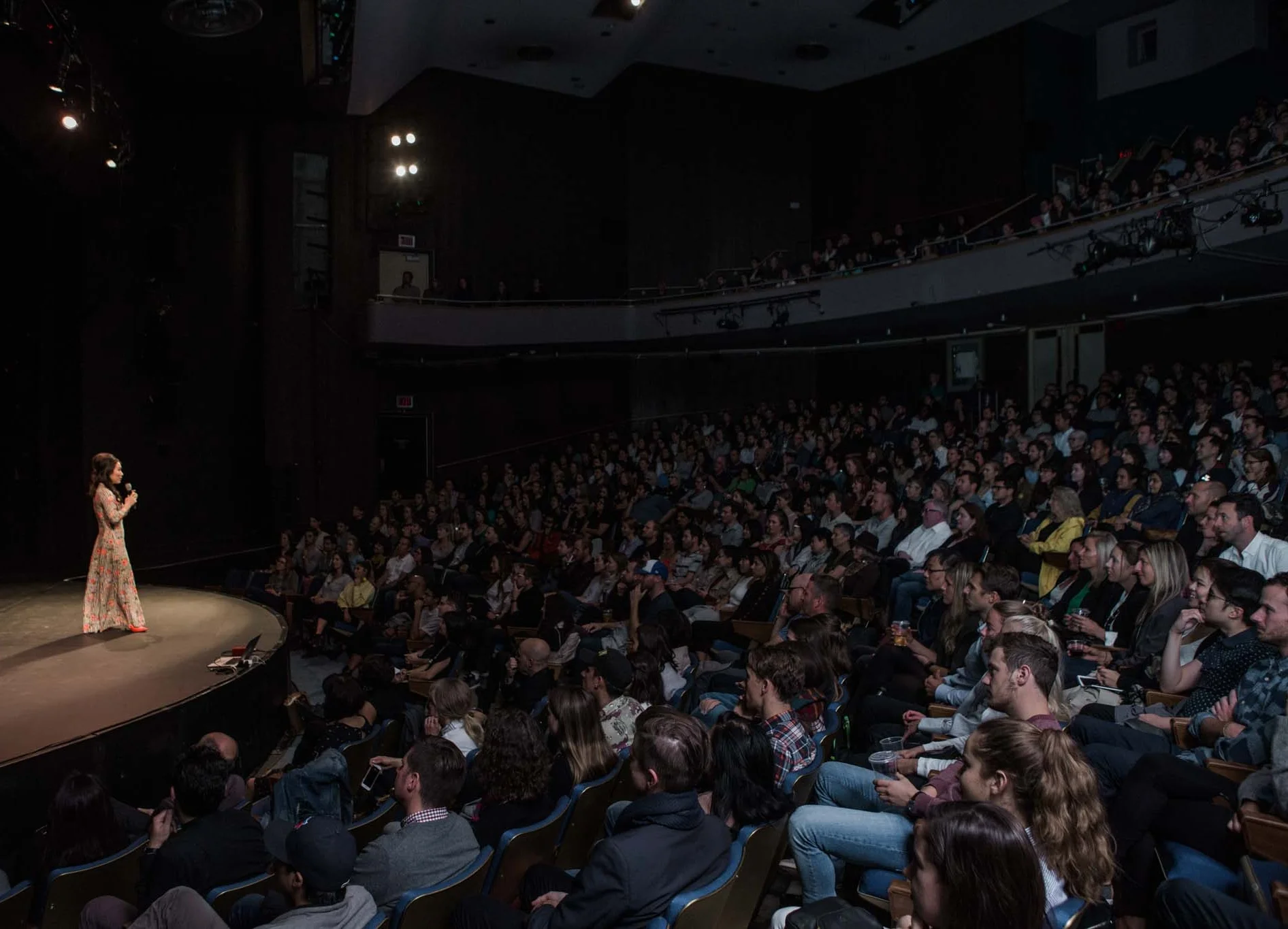 Pennylane Shen on stage at Pecha Kucha The Vogue Theatre Vancouver.