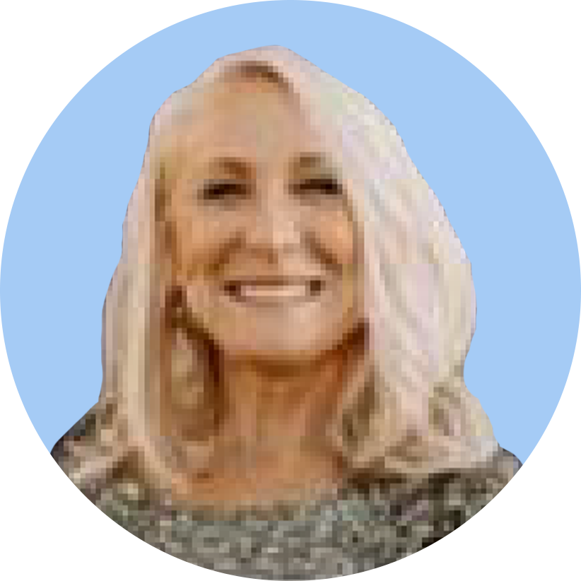 A woman with blonde, wavy hair smiling against a blue background.